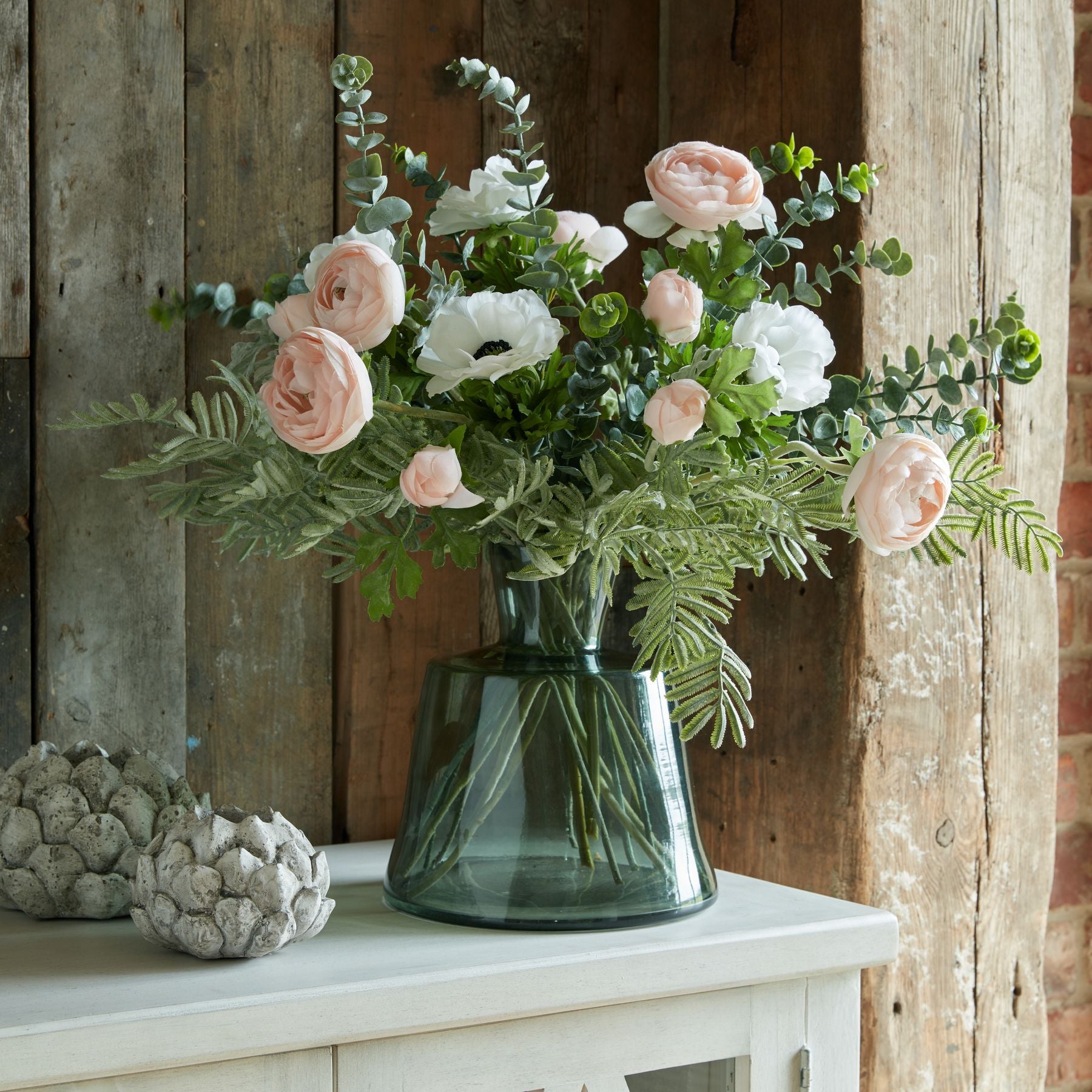 White or pink faux ranunculus flower stem from Sable Homeware, showcasing realistic silk flowers on a green stem.