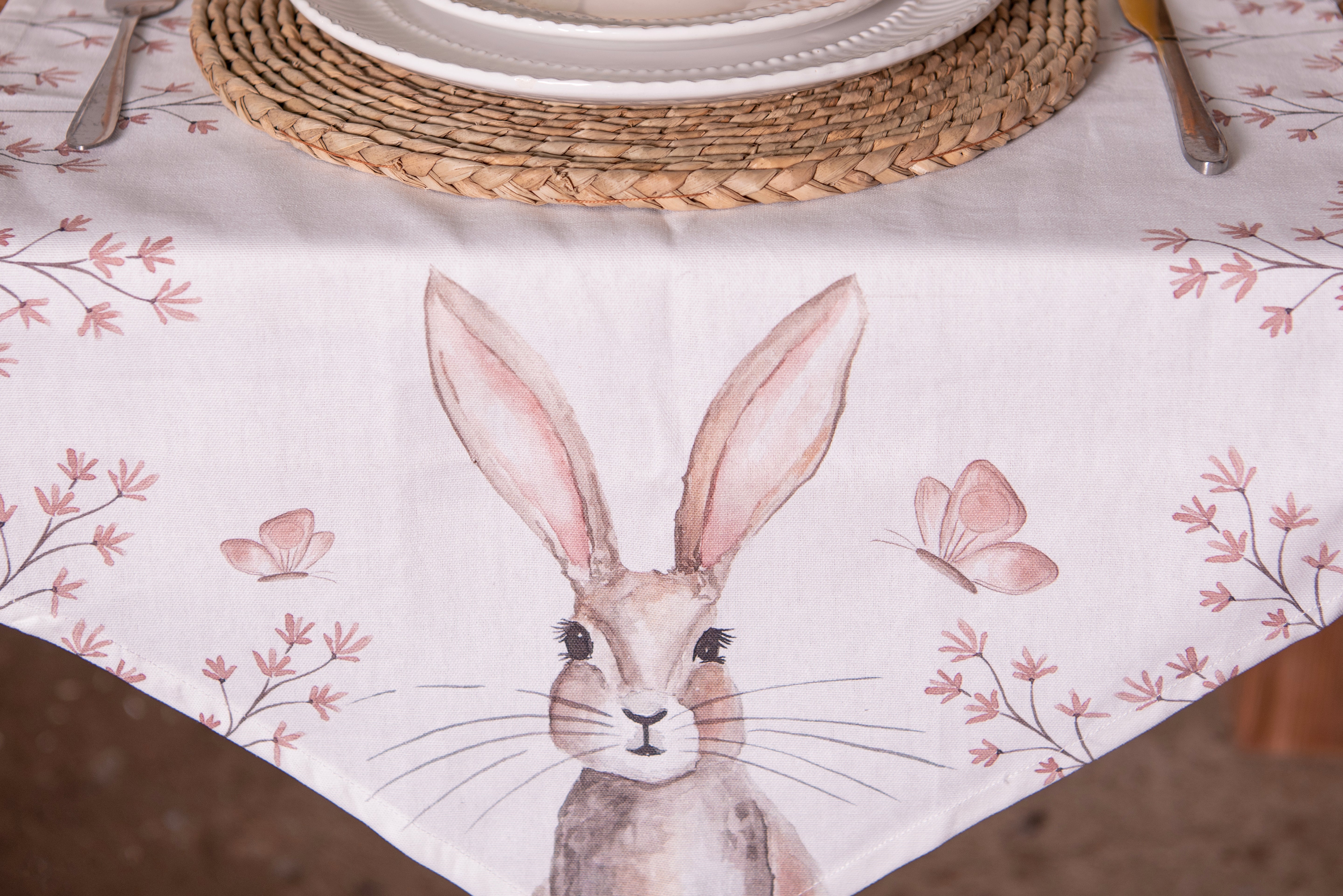 Shabbyquins Bunny table runner made of fabric, available in two lengths, featuring a charming bunny design on a textured tablecloth.