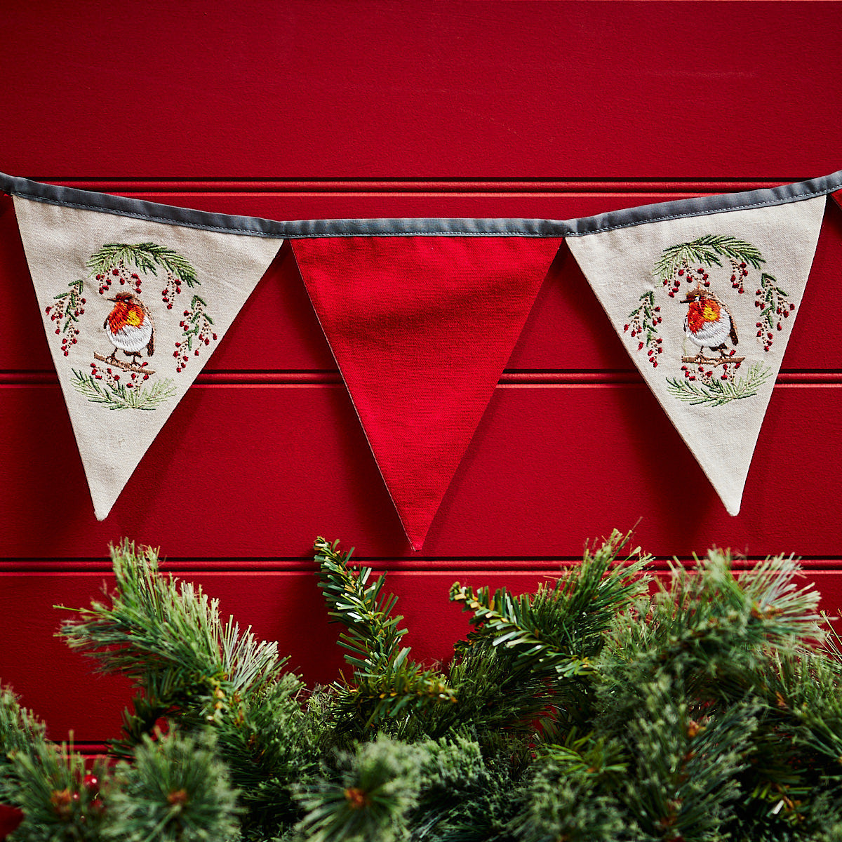 Shabbyquins Christmas Robin bunting garland with colorful fabric robin motifs hanging on a festive background.