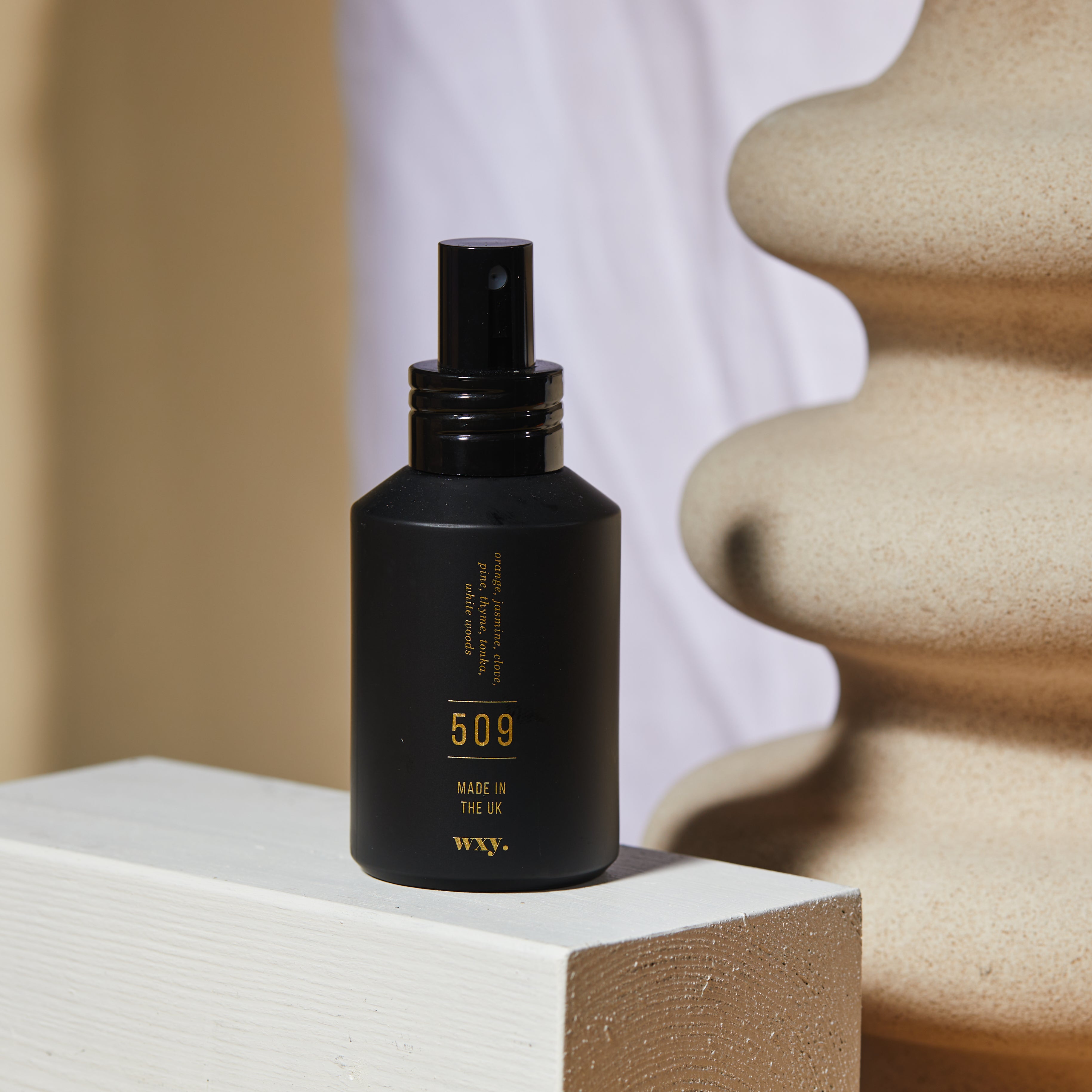 Sable Homeware Wxy Luxury Umbra Candle and Room Spray in a stylish candle holder with a sleek design.