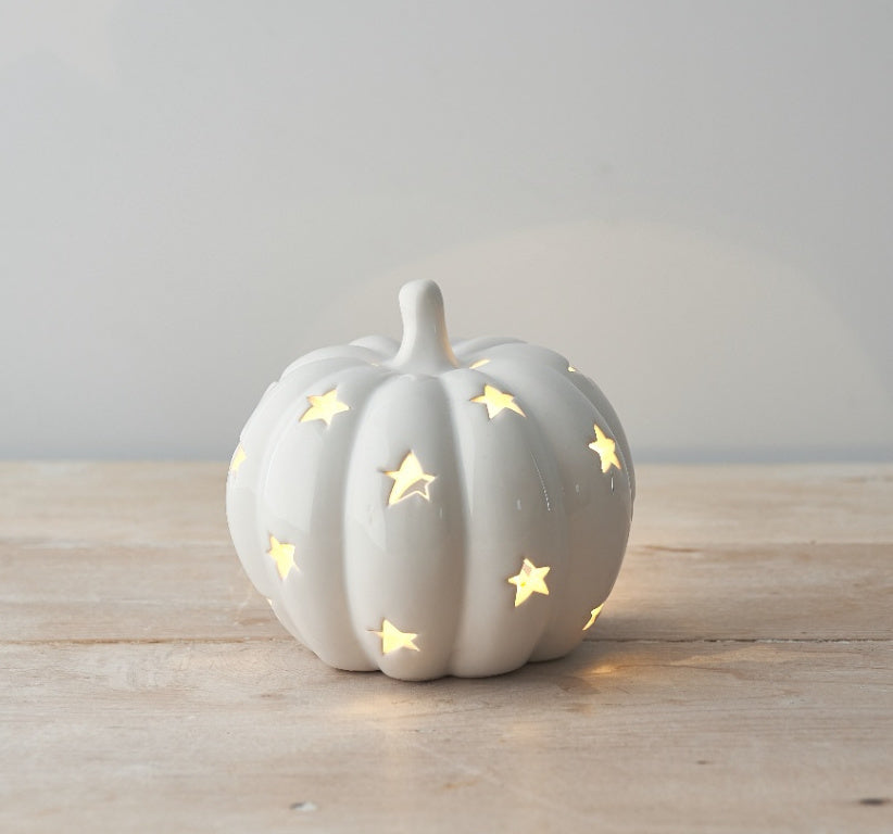 White ceramic LED pumpkin ornament by Sable Homeware, decorative fall or Halloween display, with soft glowing light.