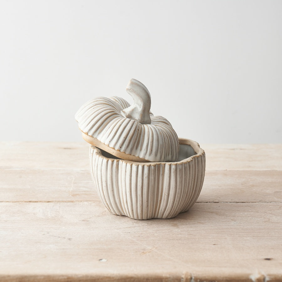 Set of two natural glazed ceramic pumpkin pots for Halloween by Sable Homeware, featuring vibrant orange and textured surfaces.