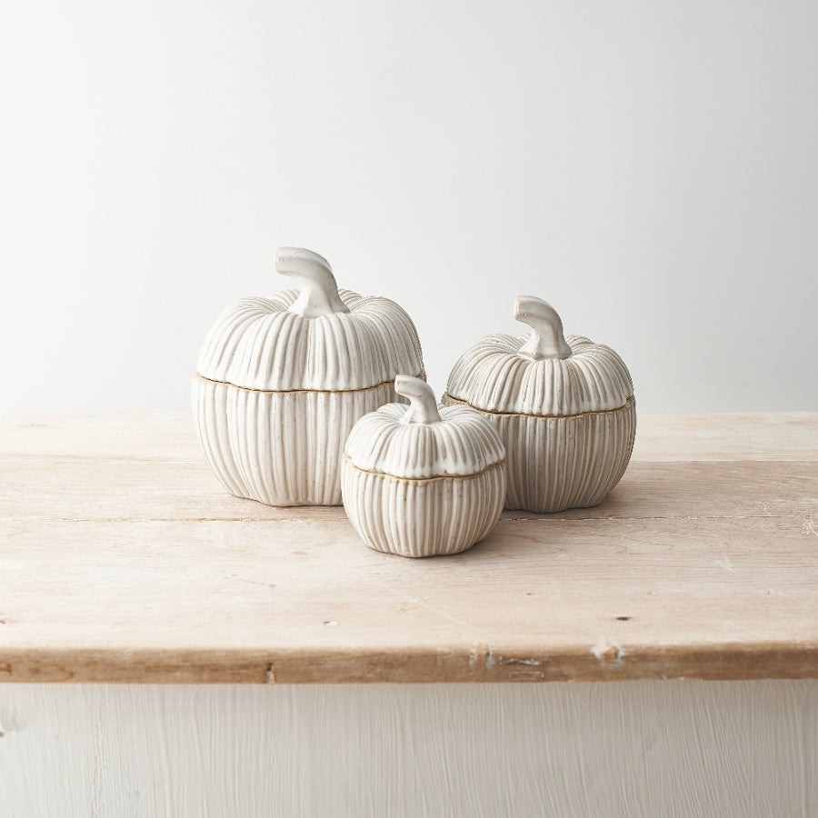 Set of two natural glazed ceramic pumpkin pots, Halloween-themed decorative planters by Sable Homeware, with orange and brown finishes.