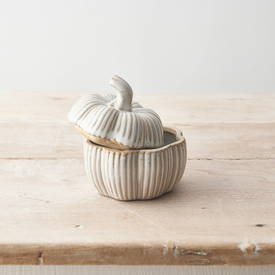 Set of two natural glazed ceramic pumpkin pots for Halloween by Sable Homeware, featuring orange and brown finishes with carved pumpkin details.