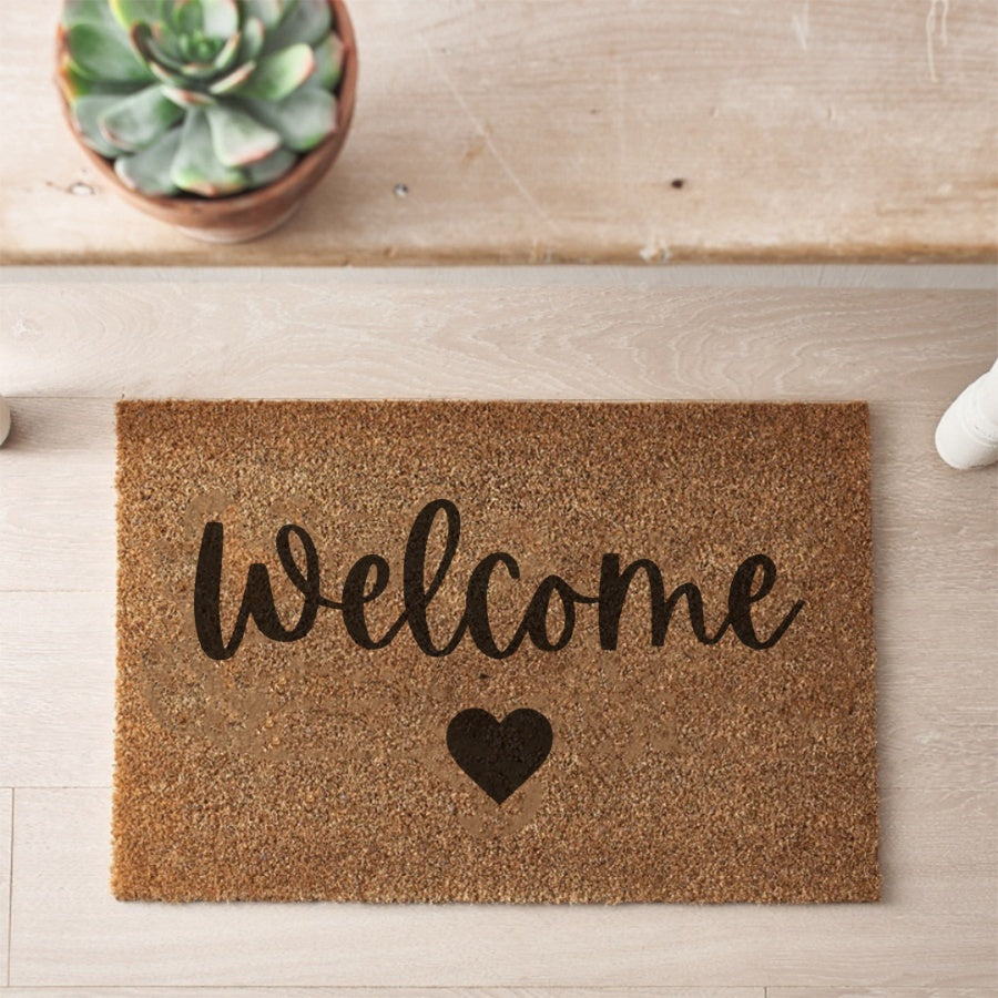 Sable Homeware door mat with decorative pattern, made of durable material, placed at entrance of a modern home.