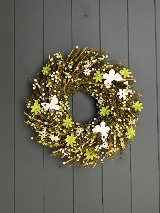 Butterfly floral spring wreath with colorful blooms and greenery, designed for home decor by Sable Homeware.
