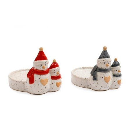 Snowman candle holder by Sable Homeware featuring a festive, white snowman design with a hollow center for candles.