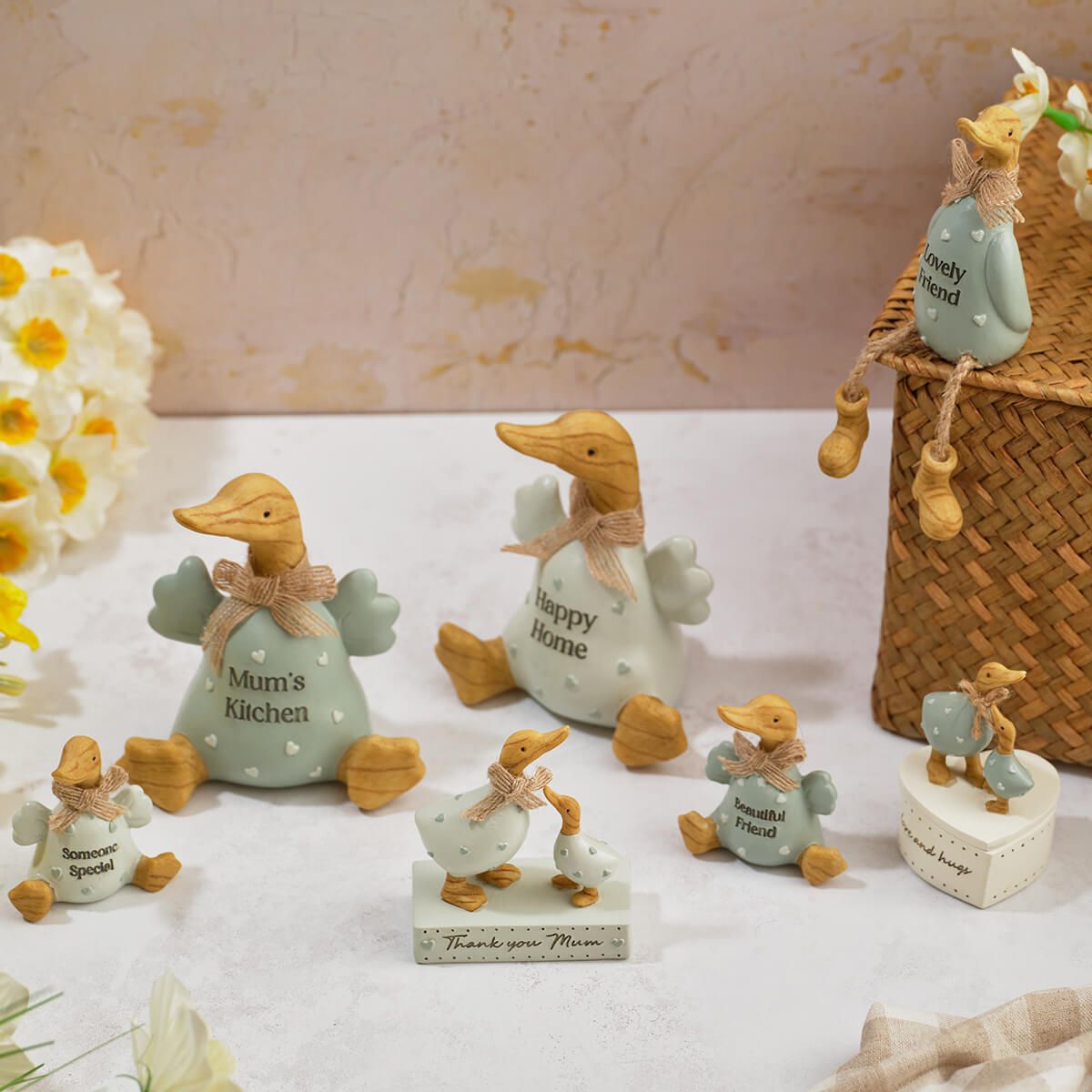 Decorative embossed ceramic ducks featuring "Happy Home" and "Mum's Kitchen" designs from Sable Homeware, ideal as charming ornaments.