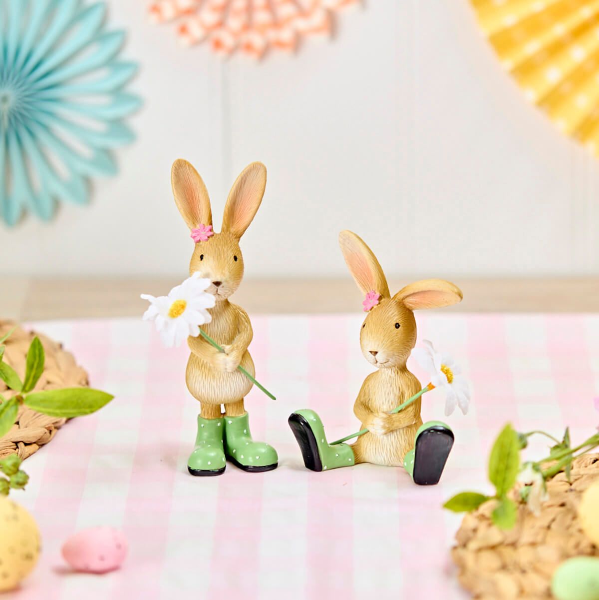 Set of 2 resin bunny ornaments with colorful flower details, decorative shabby chic accents for home or garden decor.