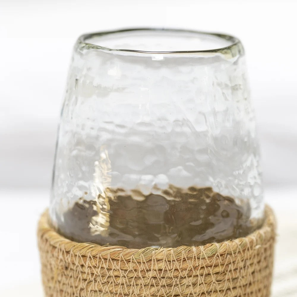 Hammered glass tea light candle holder in a jute basket from Sable Homeware, showcasing a rustic, textured design.