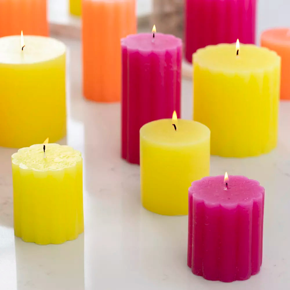 Set of rustic scalloped lemon pillar candles in candle holders, featuring vintage-inspired Shabbyquins design and natural candlelight.