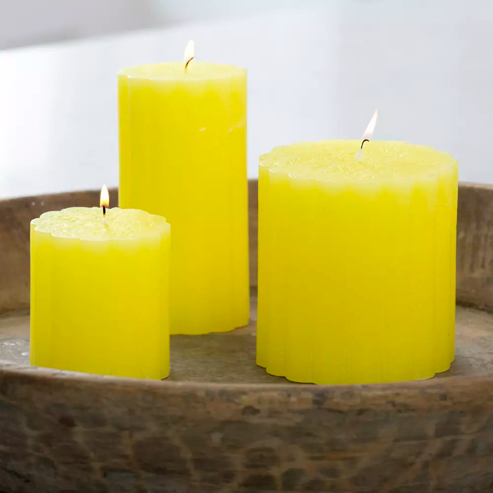 Rustic scalloped lemon pillar candles in a Shabbyquins candle holder, featuring a vintage-inspired design with textured surface.