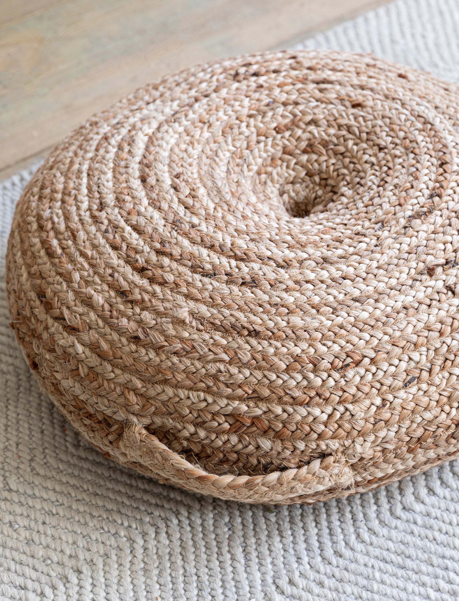 Natural jute floor cushion by Sable Homeware featuring a soft, woven texture and a neutral color for cozy seating.