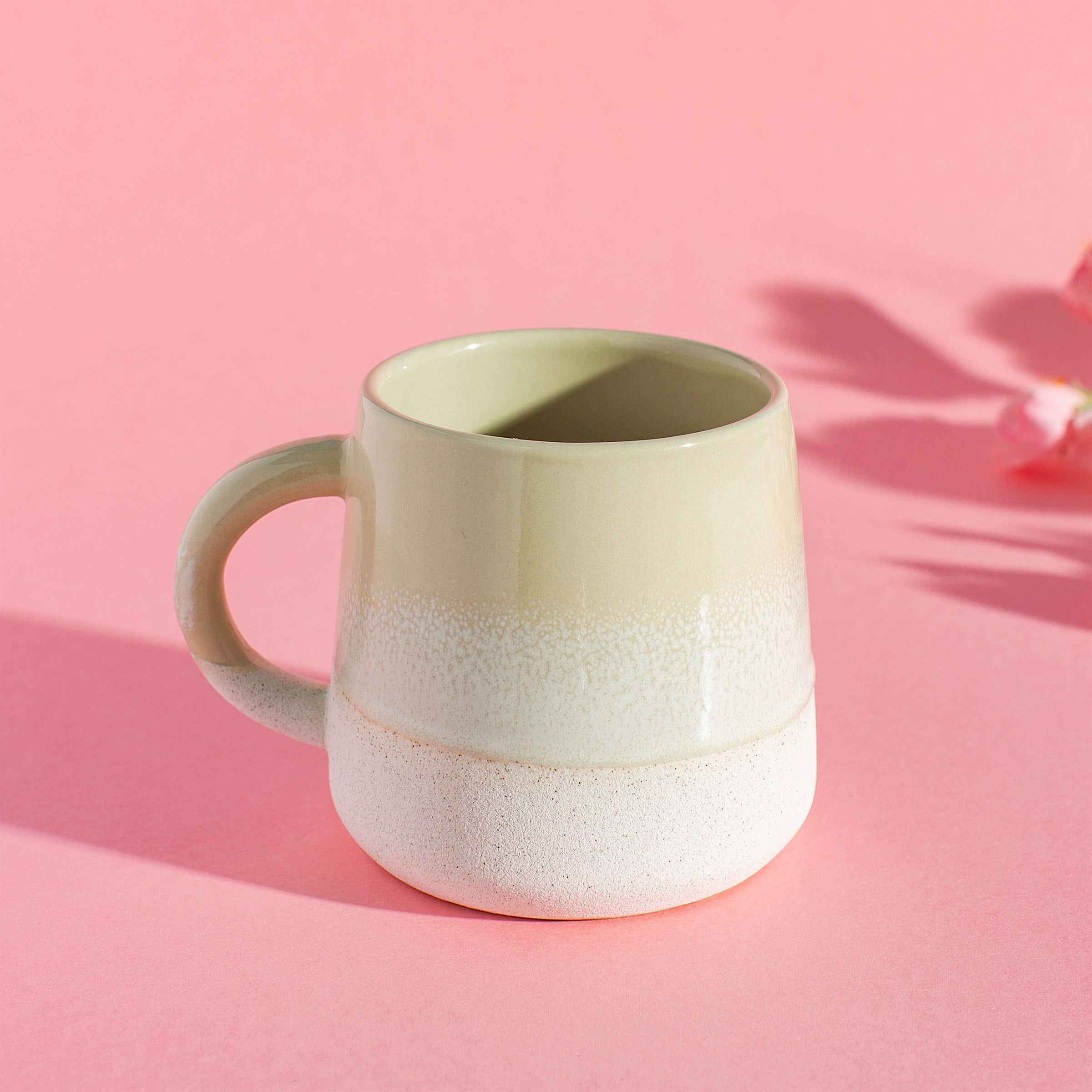 Sable Homeware Mojave Glaze Mug in multiple colors, ceramic coffee mug with a smooth glazed finish, shown in a lifestyle setting.