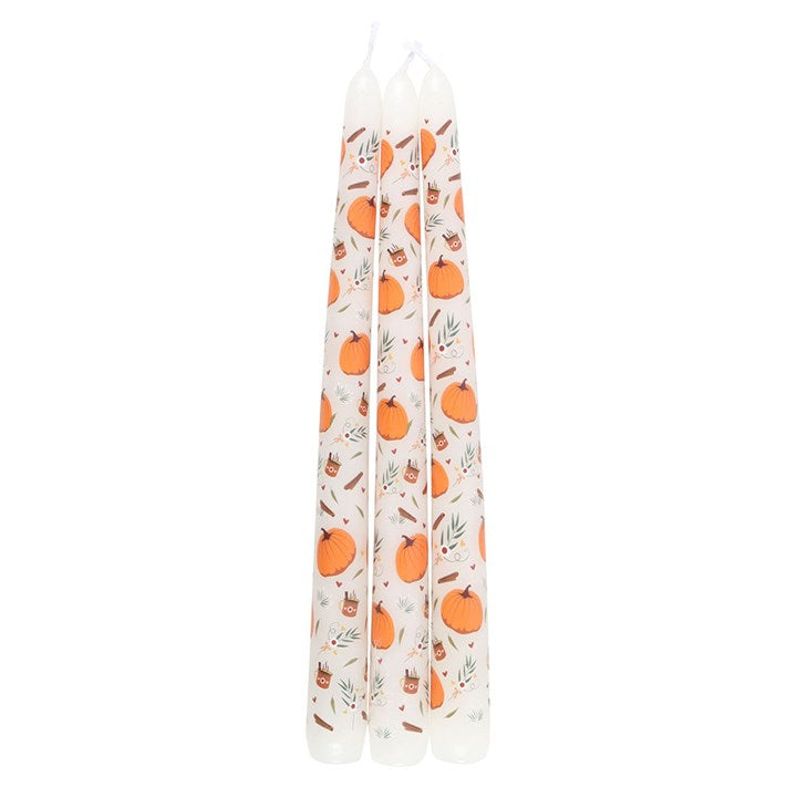 Set of three pumpkin-shaped taper candles from Sable Homeware with warm orange and brown hues, perfect for autumn decor.