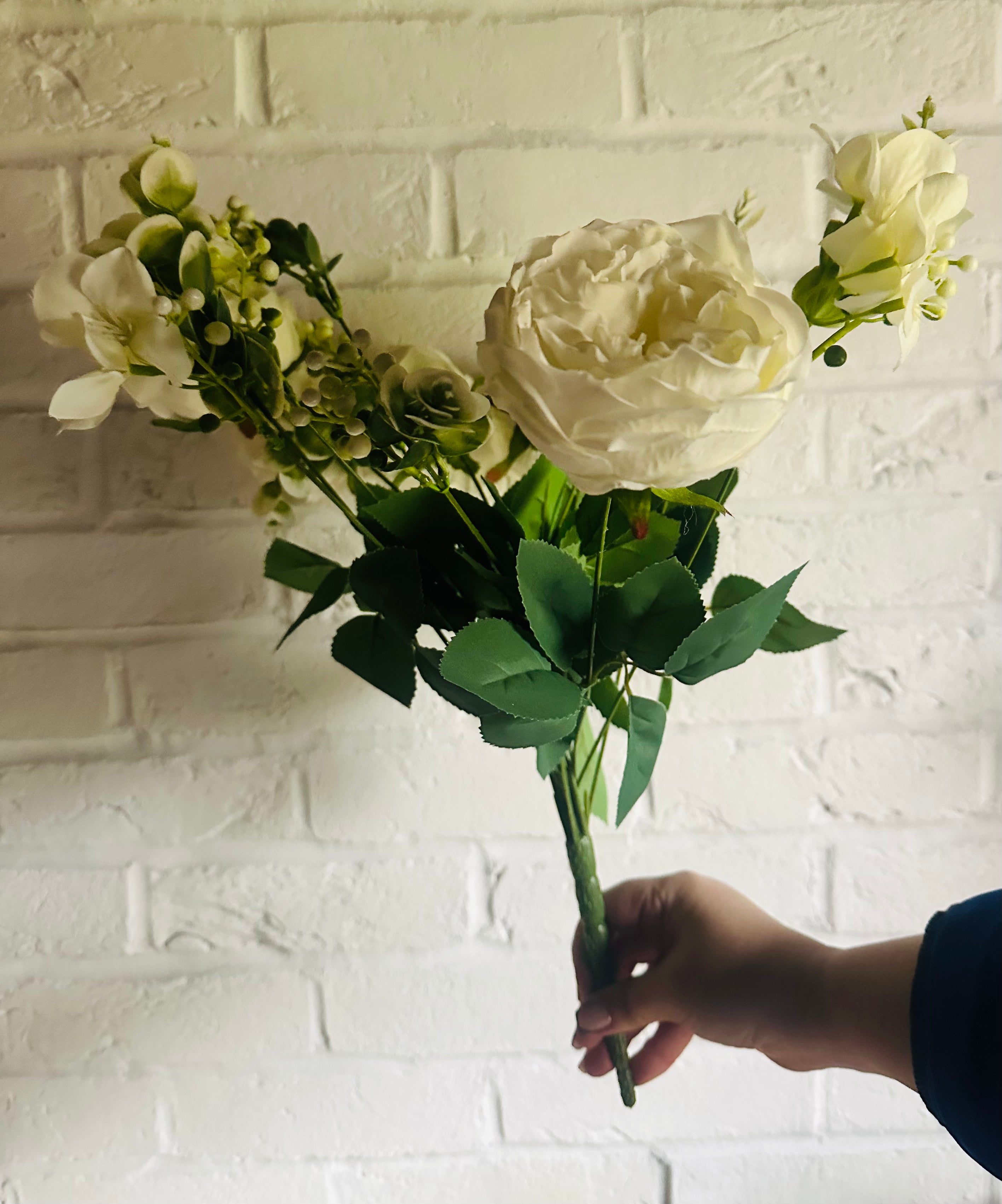 Faux white roses and foliage spray with white roses and green leaves by Sable Homeware