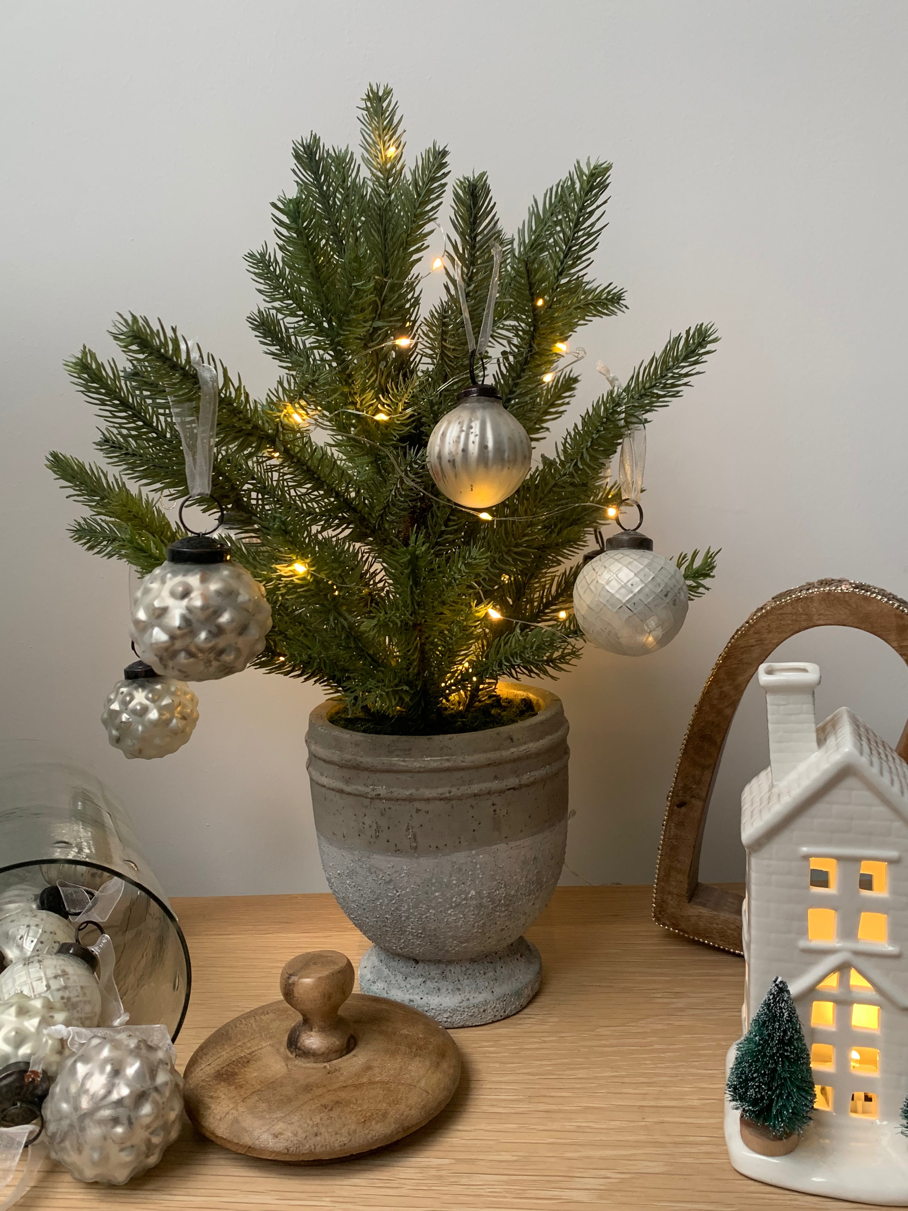 Decorative pine tree wreath from Sable Homeware in a stone pot, perfect for seasonal or holiday decor.