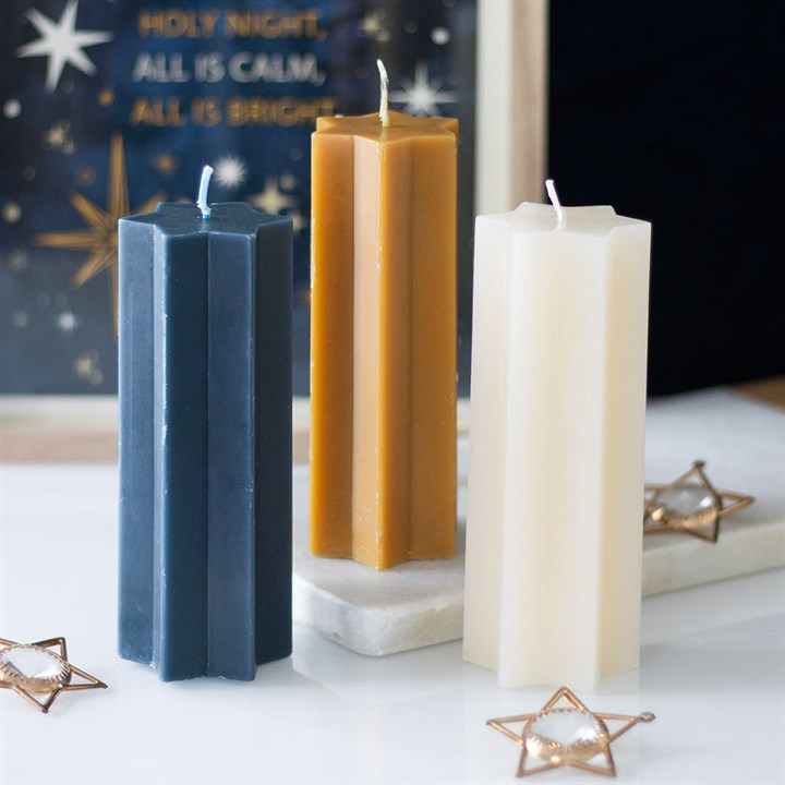 Star-shaped taper candles from Sable Homeware in three colors, featuring a decorative star design for elegant lighting.