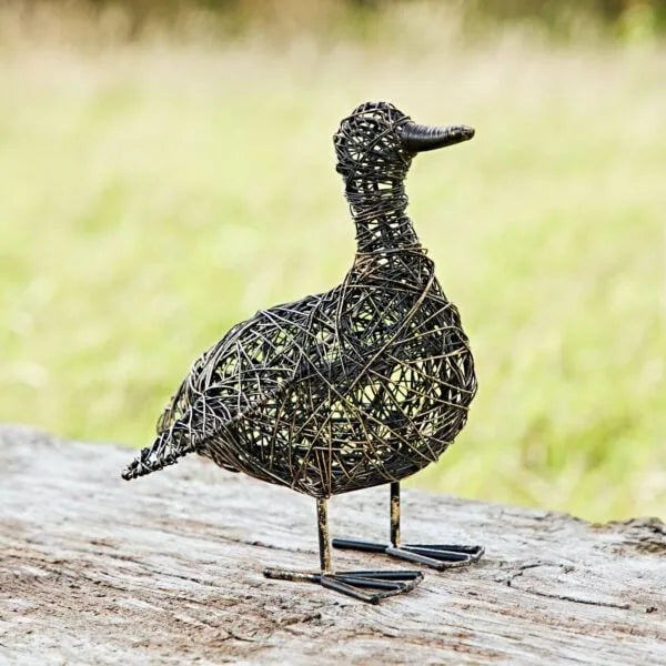 Small wire garden duck ornament named Kriti with flapping wings, crafted by Sable Homeware for outdoor decoration.