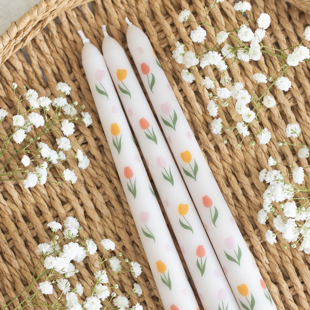 Set of three Sable Homeware tulip print taper candles with colorful floral patterns on a white background.