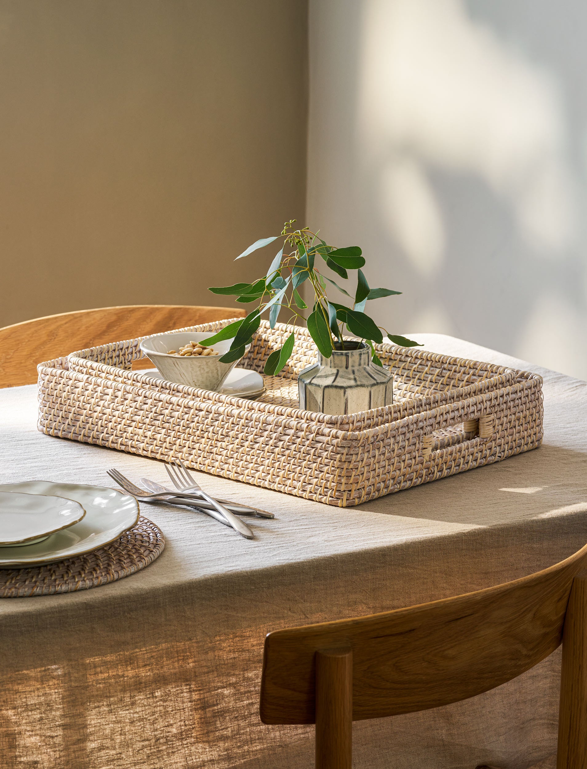 Set of two Wittering Rattan Rectangular Baskets by Sable Homeware, showing woven rattan baskets with handles on a neutral background.