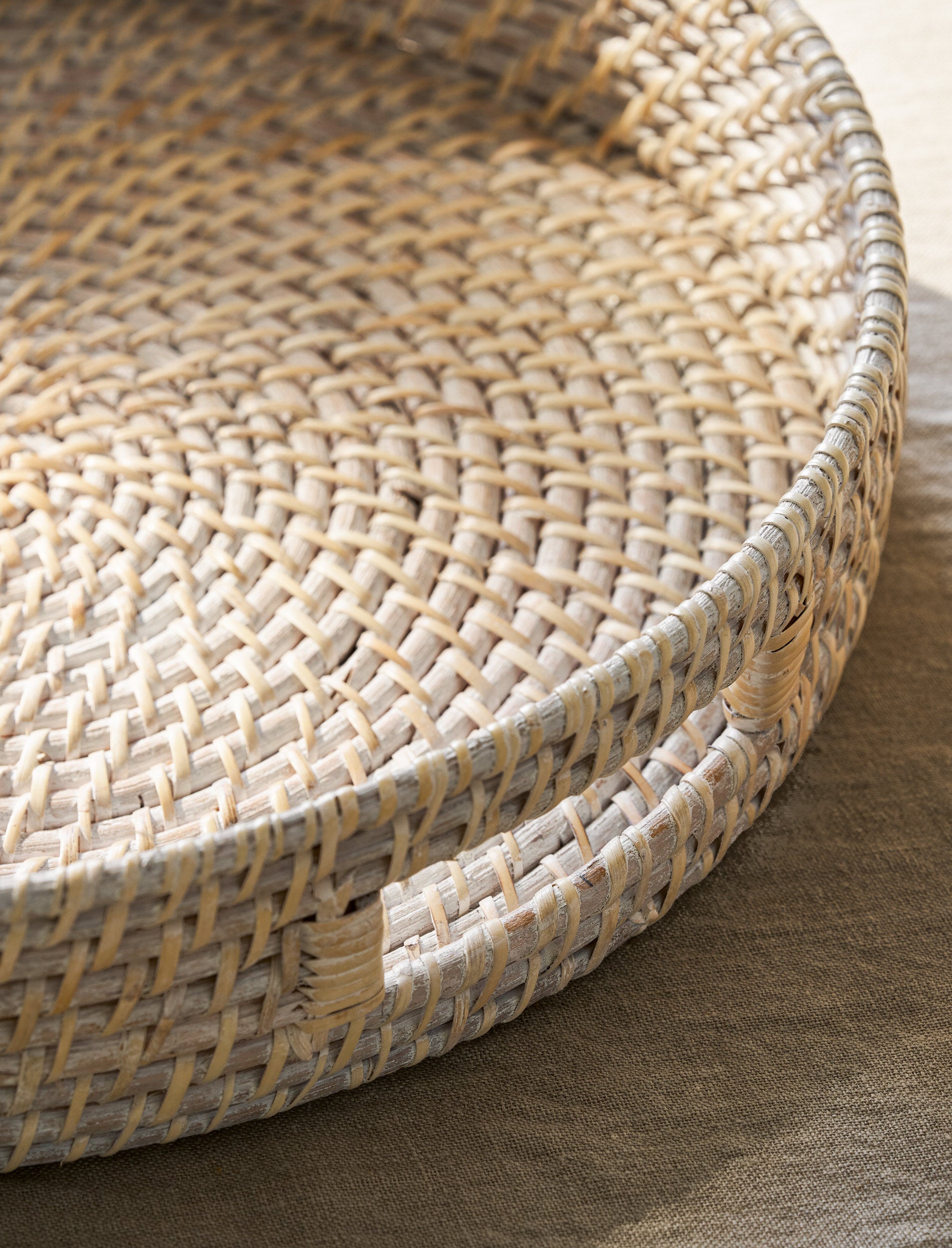 White Wittering Round Rattan Serving Board by Sable Homeware, showcasing a stylish, circular rattan tray on a neutral background.