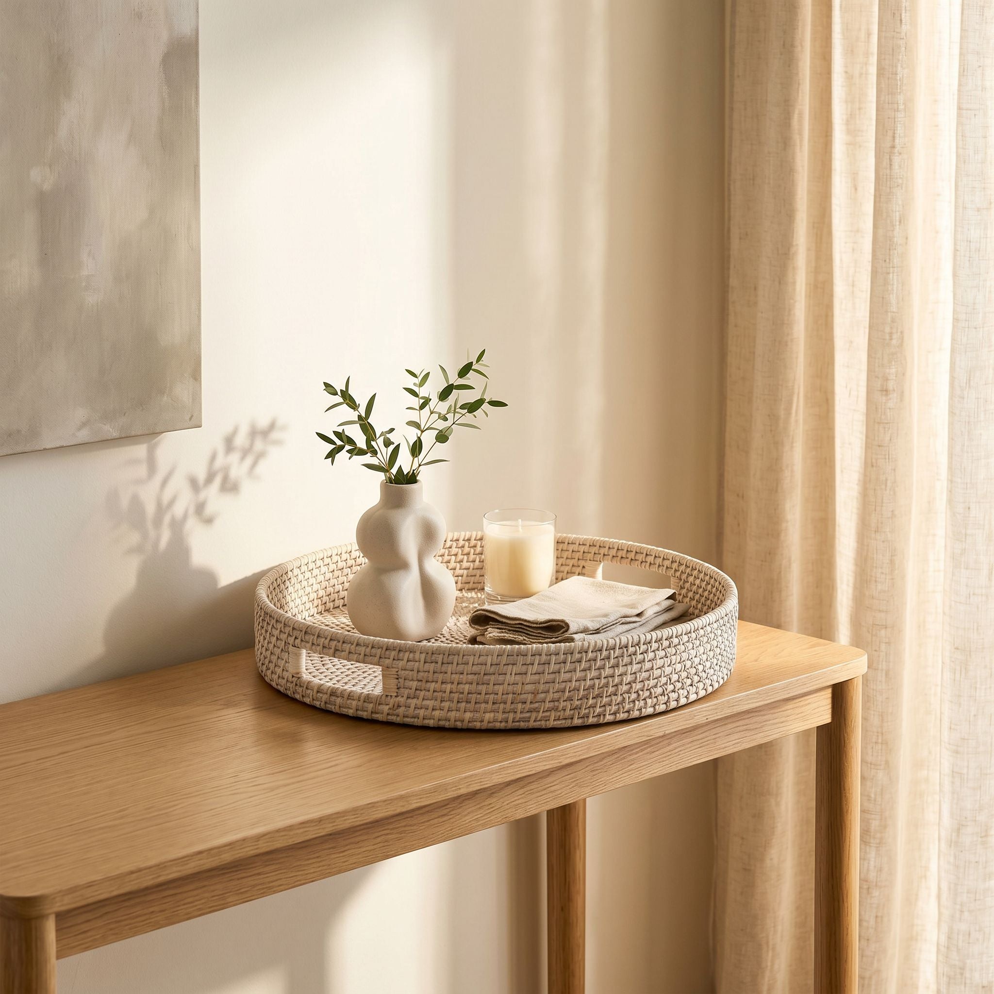Whitewashed round rattan tray by Sable Homeware, showcasing a natural woven design with handles for serving or decor.