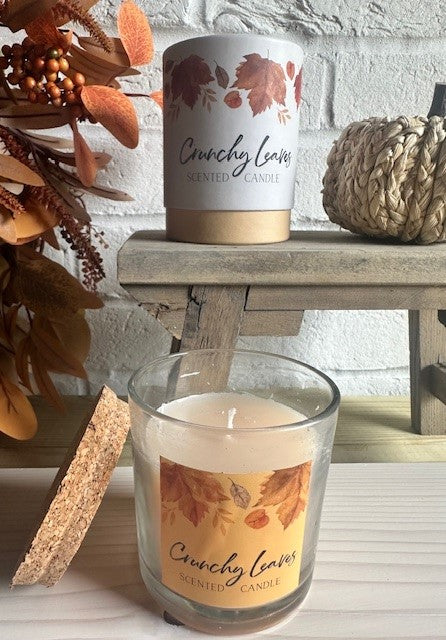 Sable Homeware autumn scented candle with crunchy leaves design, featuring warm fall-inspired colors and textured wax surface.