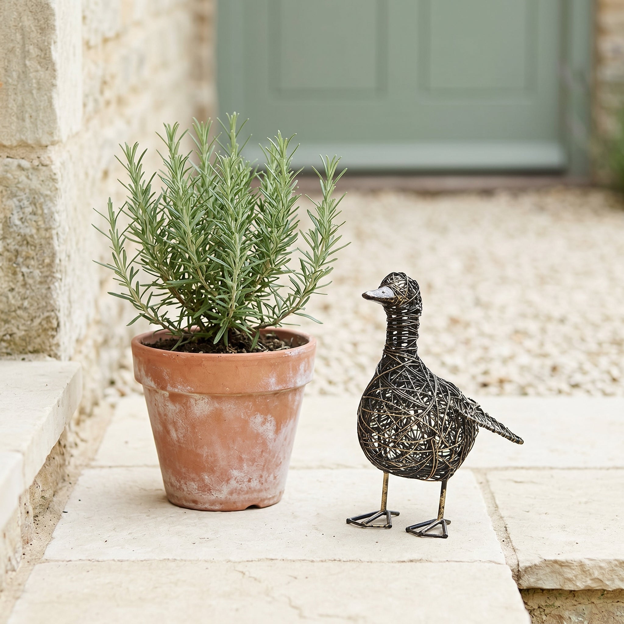 Small Kriti flapping duck wire garden ornament by Sable Homeware, featuring a charming metal duck design for outdoor decor.