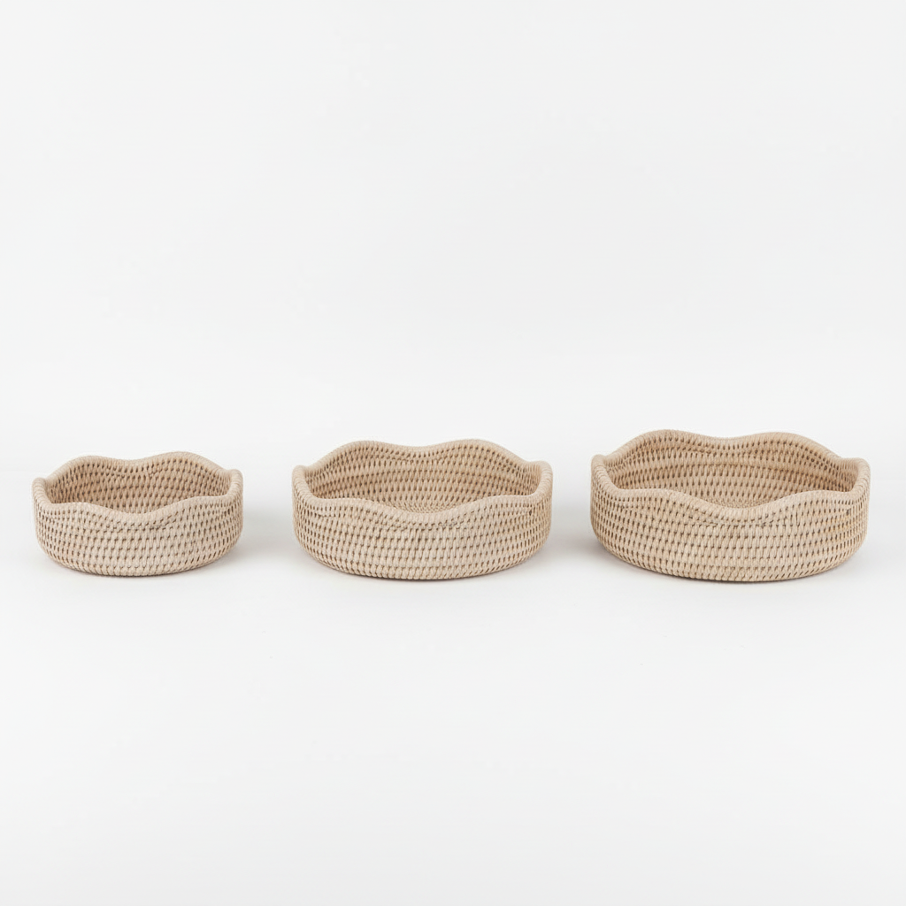 Three scalloped round rattan baskets in different sizes by Sable Homeware, showcasing their woven texture and natural finish.