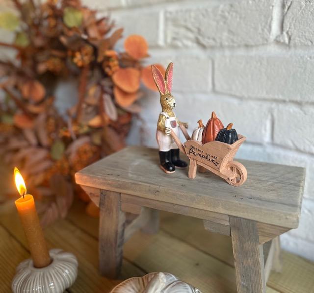 Shabbyquins Halloween ornament featuring a rabbit with a wheelbarrow, decorated with pumpkins and autumn leaves.