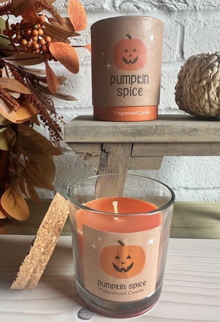 Pumpkin spice scented candle by Sable Homeware in a glass jar, showcasing warm autumn-themed design and cozy ambiance.