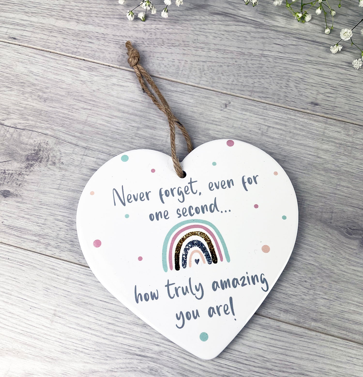 Ceramic rainbow heart plaque by Shabbyquins with colorful rainbow design and textured surface, ideal for home decor or wall display.