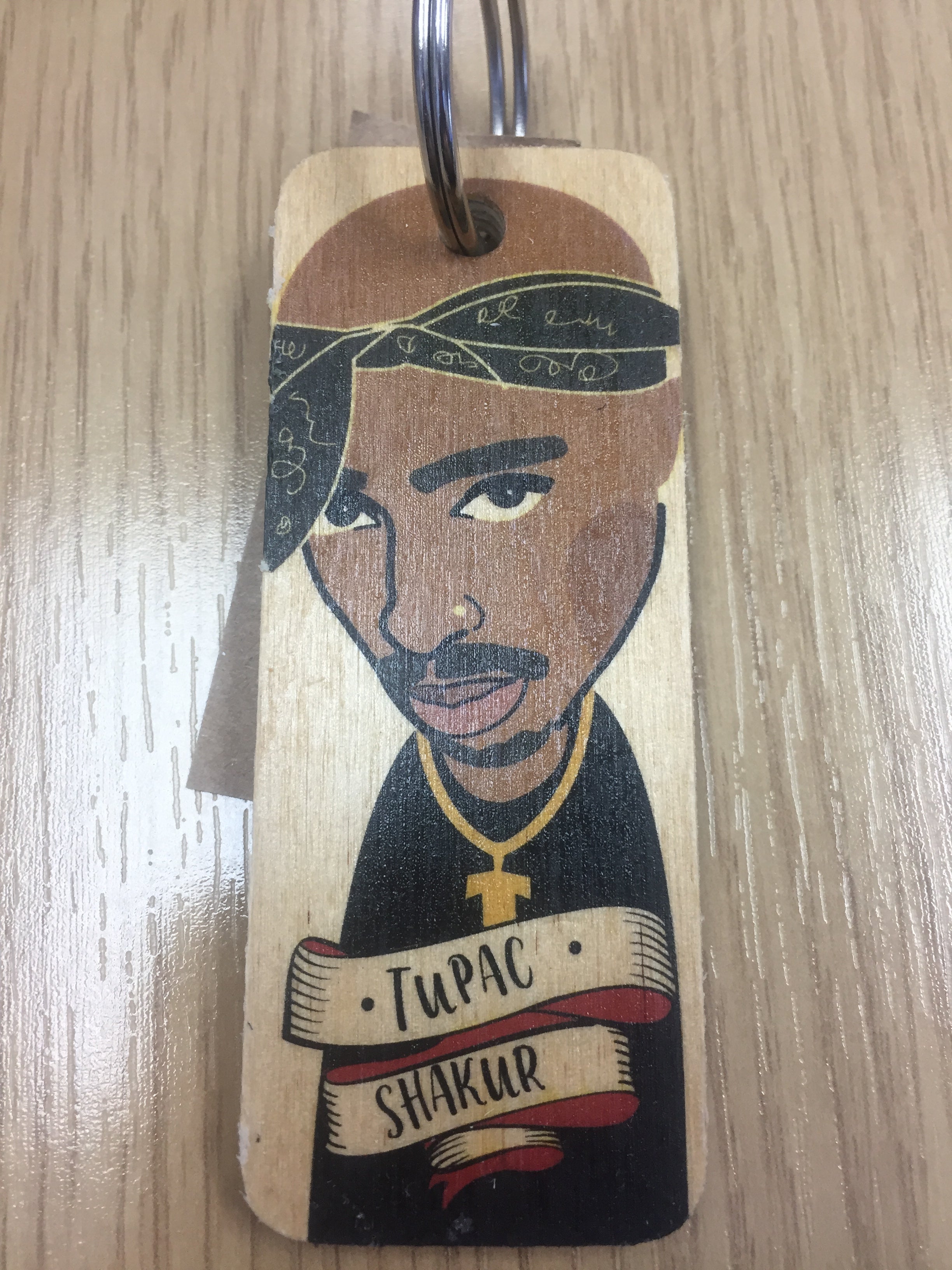 Handmade chunky wooden keyring by Sable Homeware with a smooth finish and natural wood grain, attached to metal keychain.