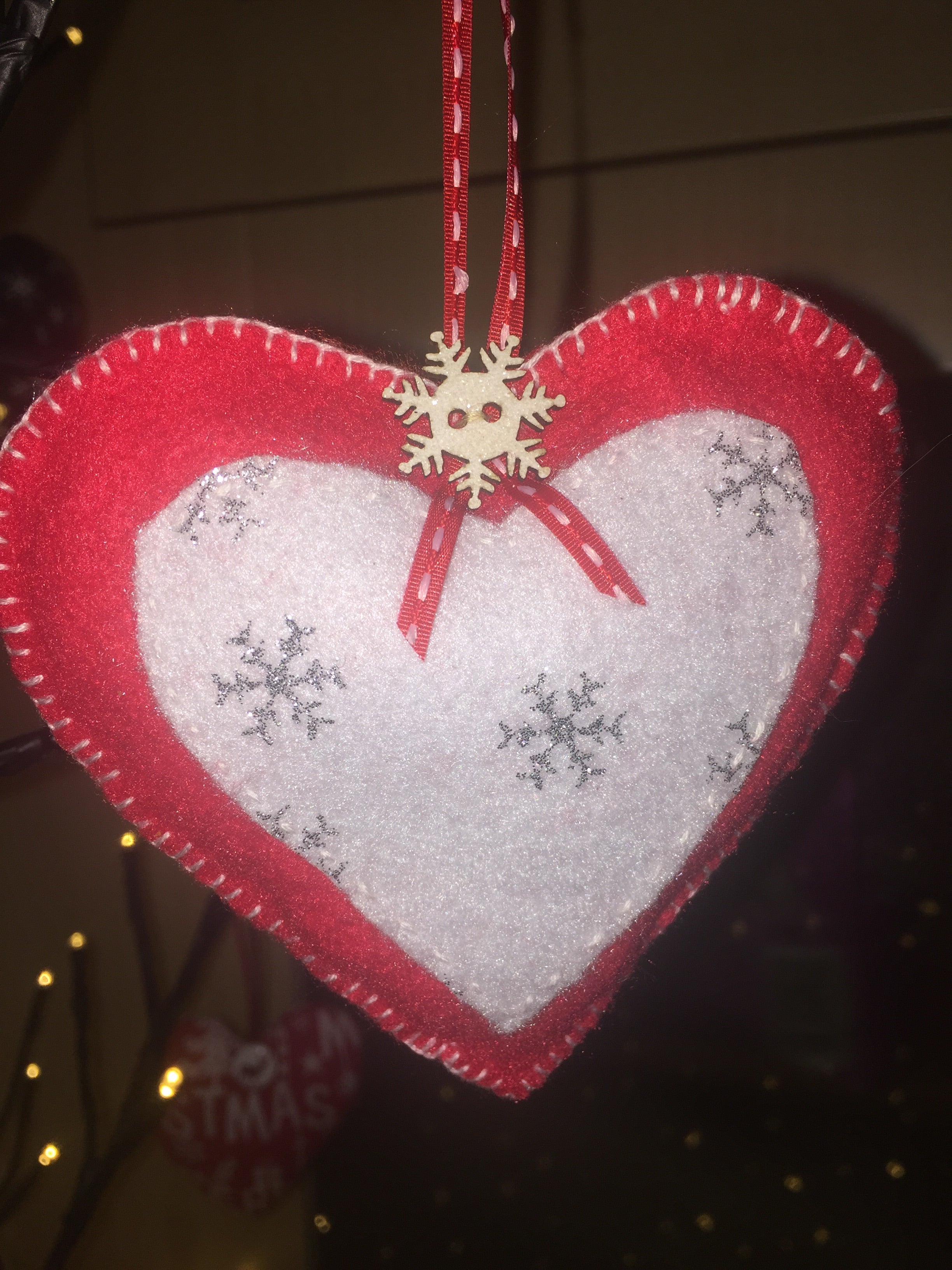 Handmade Sable Homeware Christmas Tree Ornaments featuring colorful, decorative holiday ornaments on a Christmas tree.