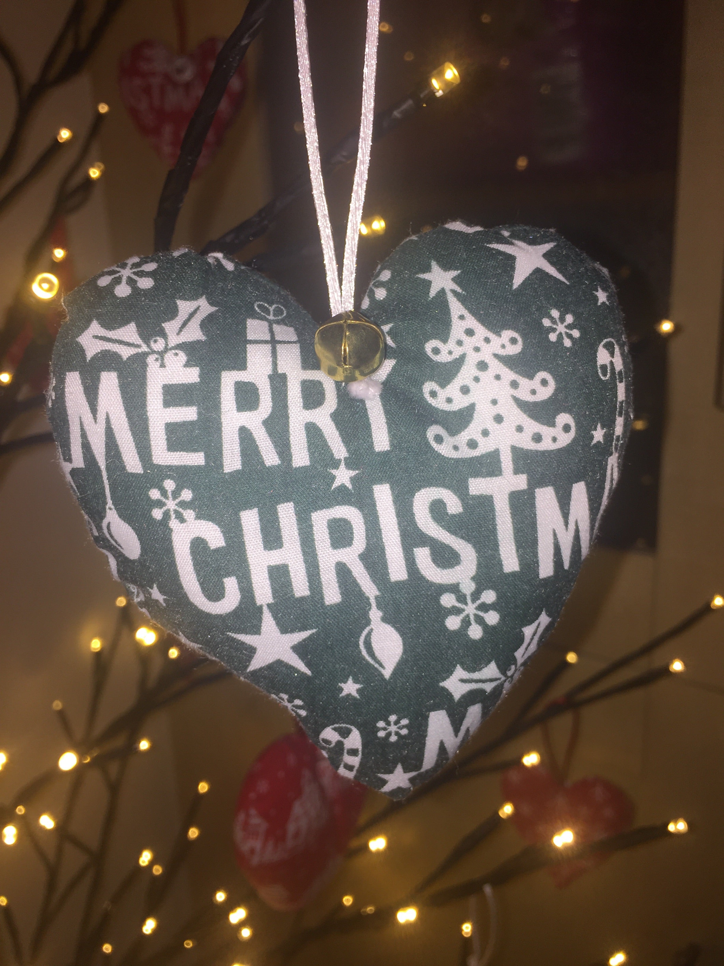 Handmade Christmas tree ornaments by Sable Homeware featuring festive holiday decorations on a decorated Christmas tree.