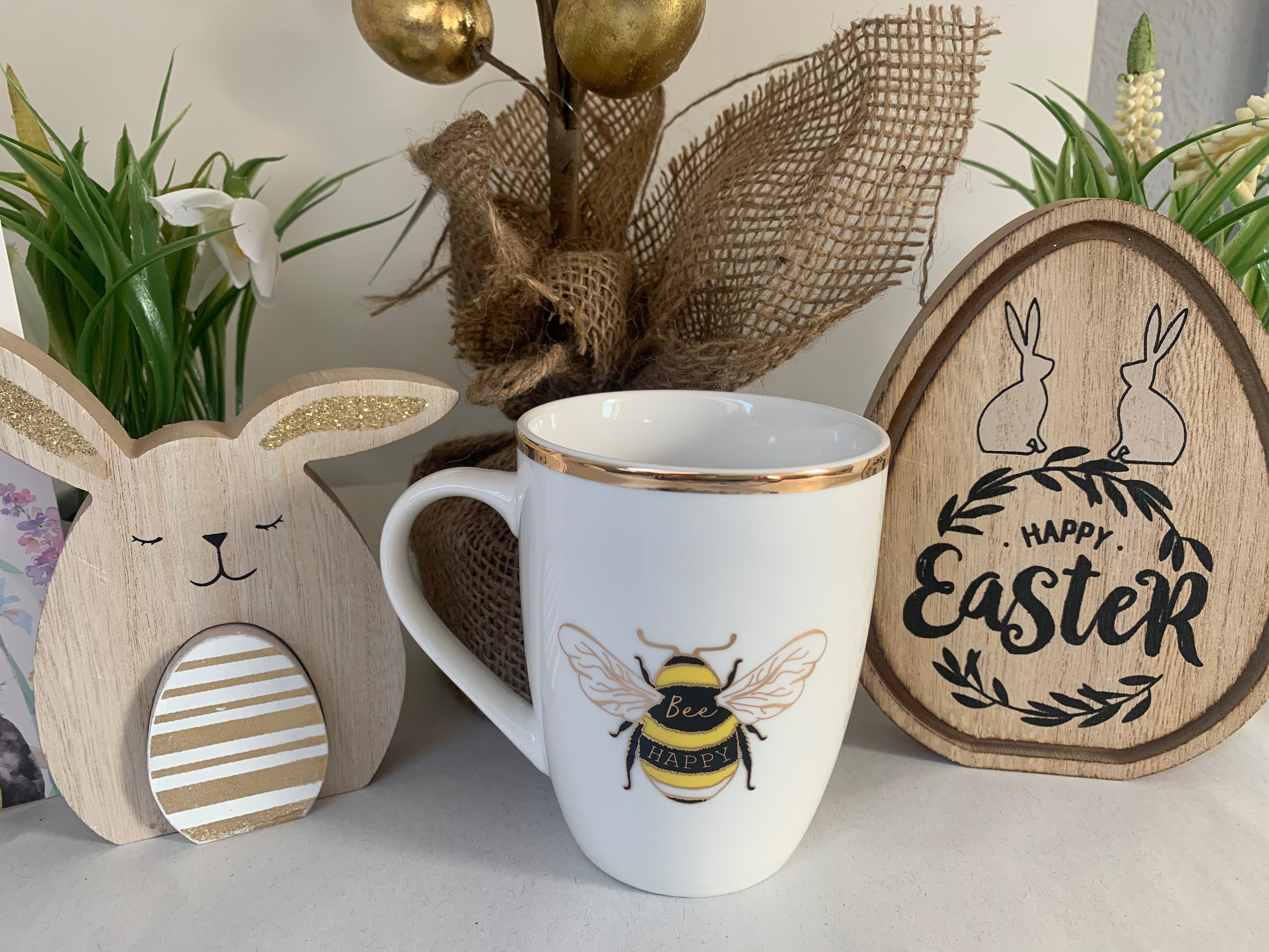 White and gold China mug with "Bee Happy" text, Shabbyquins mug featuring a cheerful bee design and elegant gold accents.