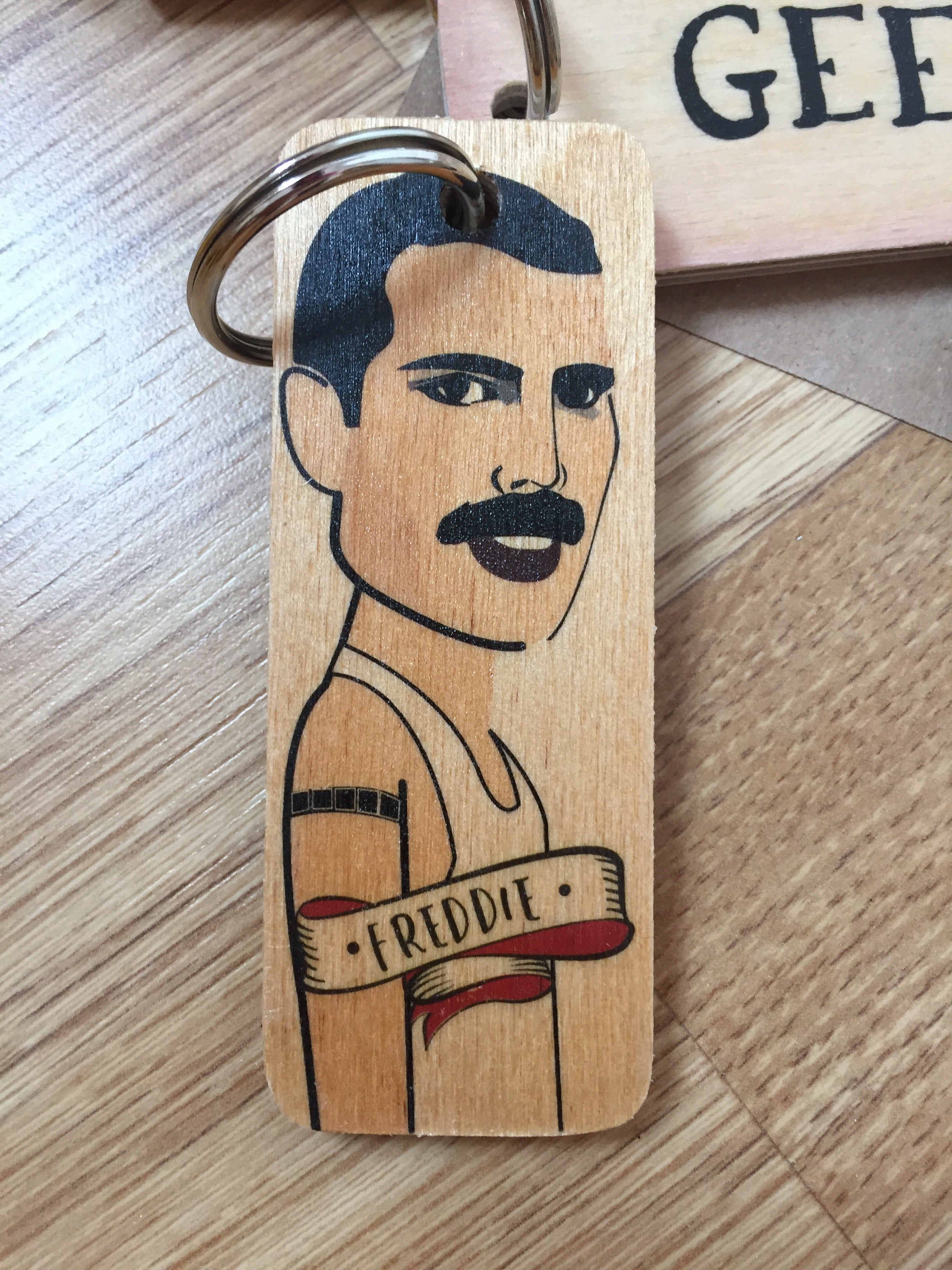Handmade chunky wooden keyring from Sable Homeware with a smooth, natural finish and durable metal keyring attachment.