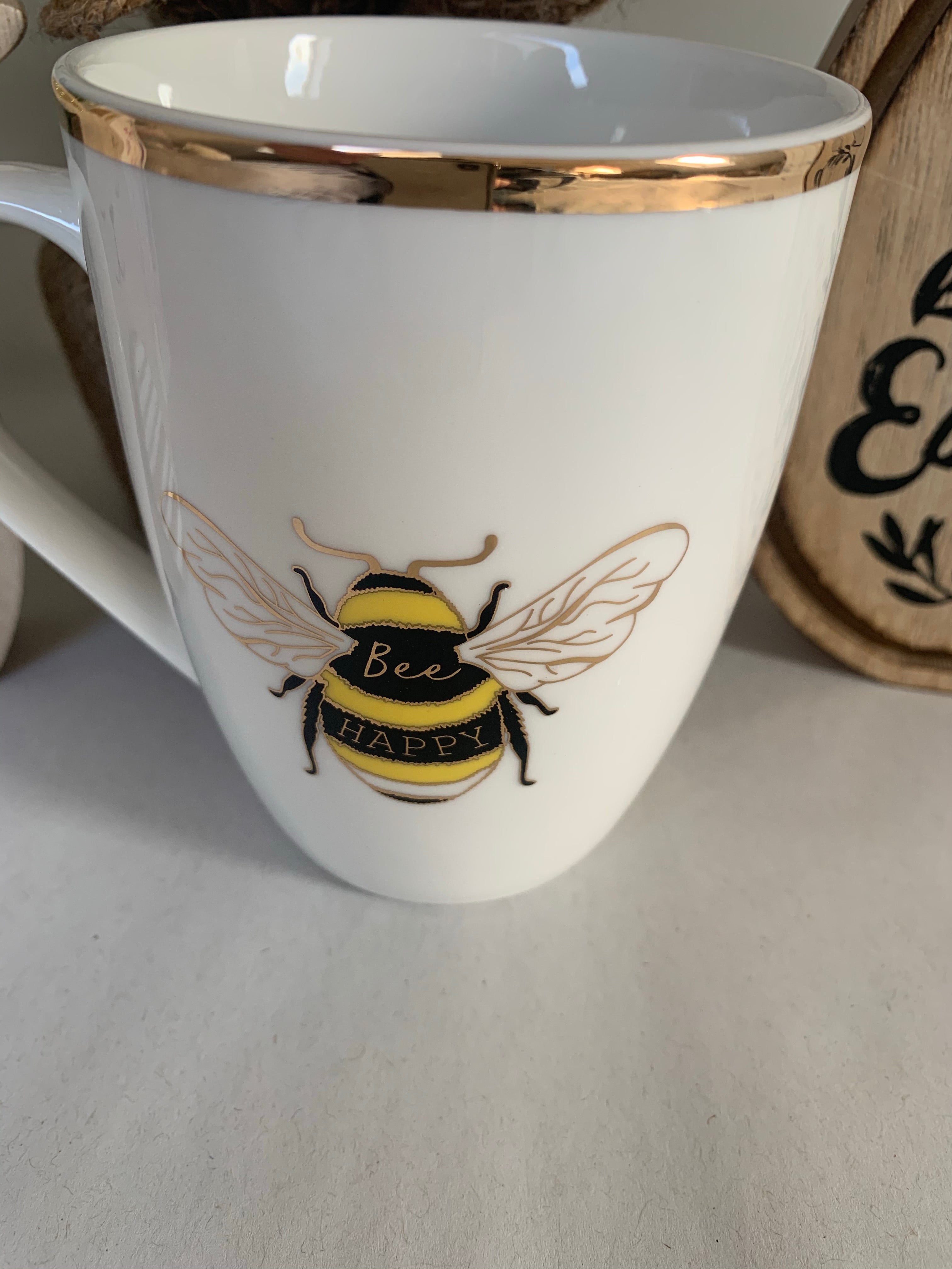 White and gold Sable Homeware Bee Happy China mug with bee and floral design, perfect for tea or coffee.