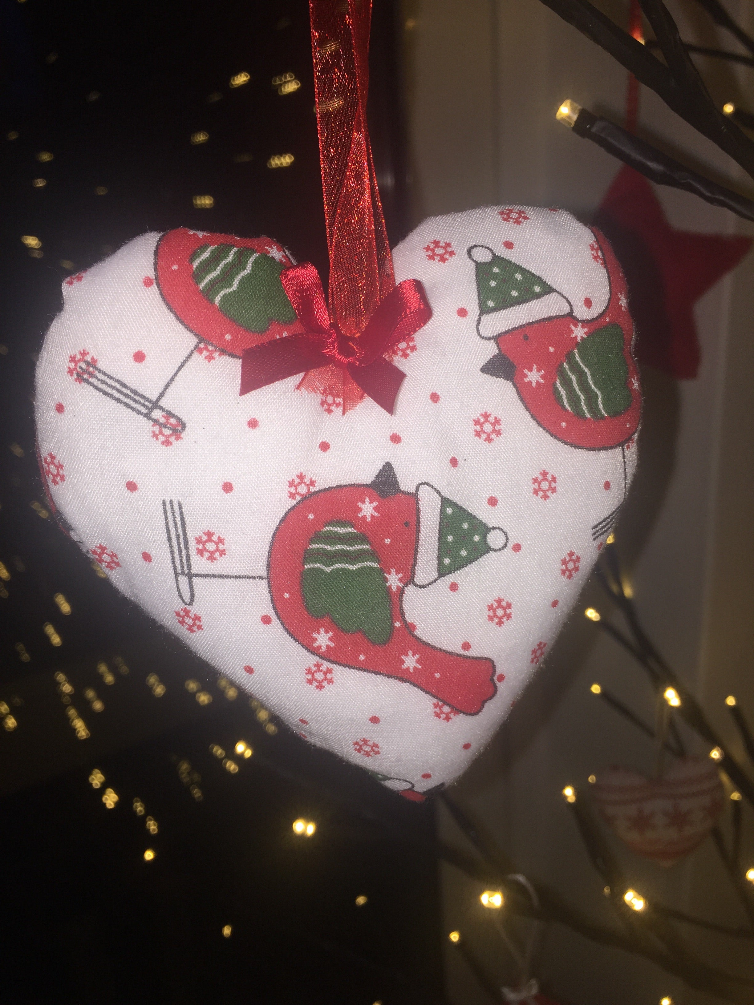 Handmade Christmas tree ornaments by Sable Homeware featuring festive designs on colorful, decorative holiday decorations.