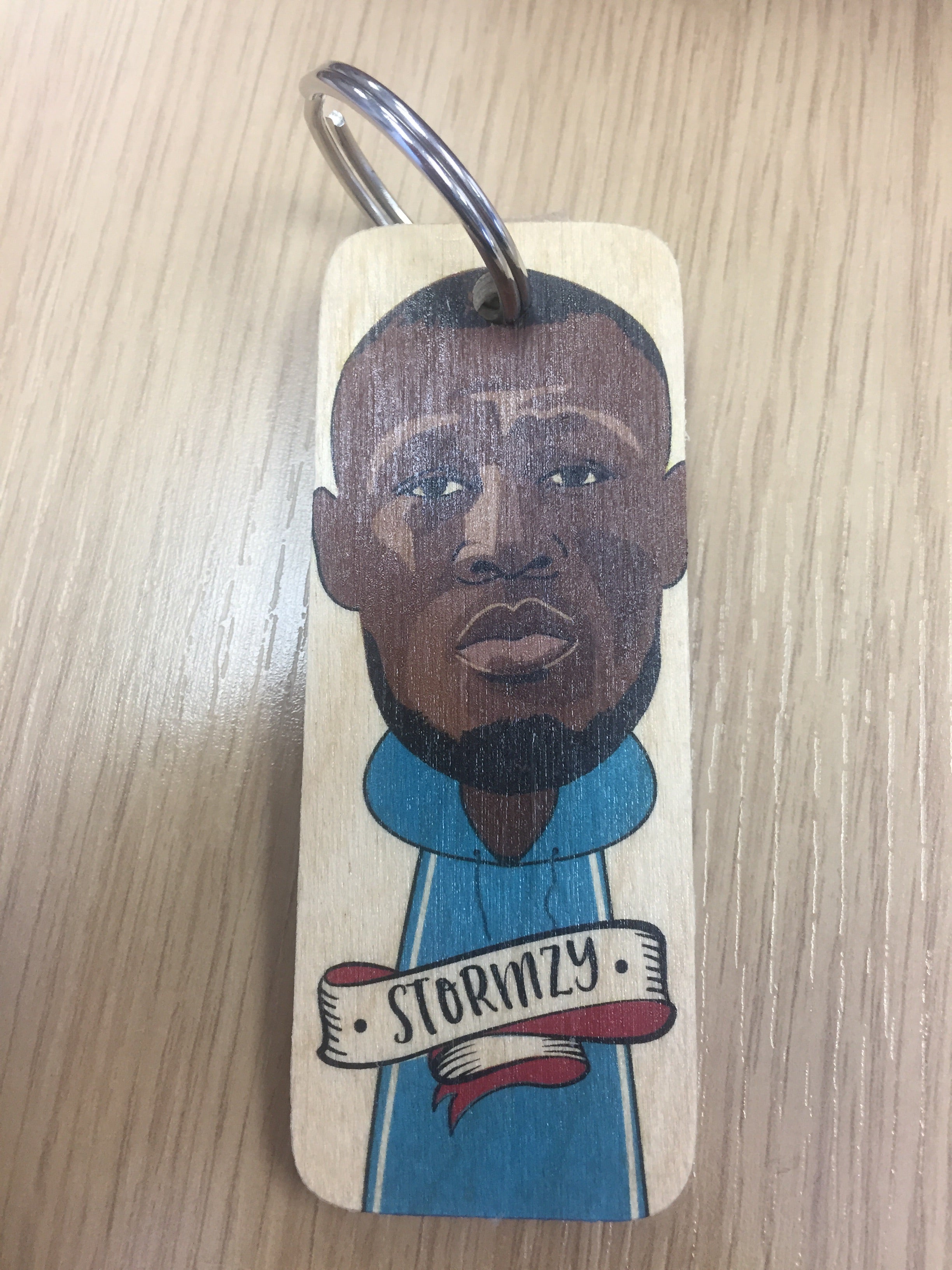 Handmade chunky wooden keyring from Sable Homeware with a natural finish and sturdy metal keyring attachment.