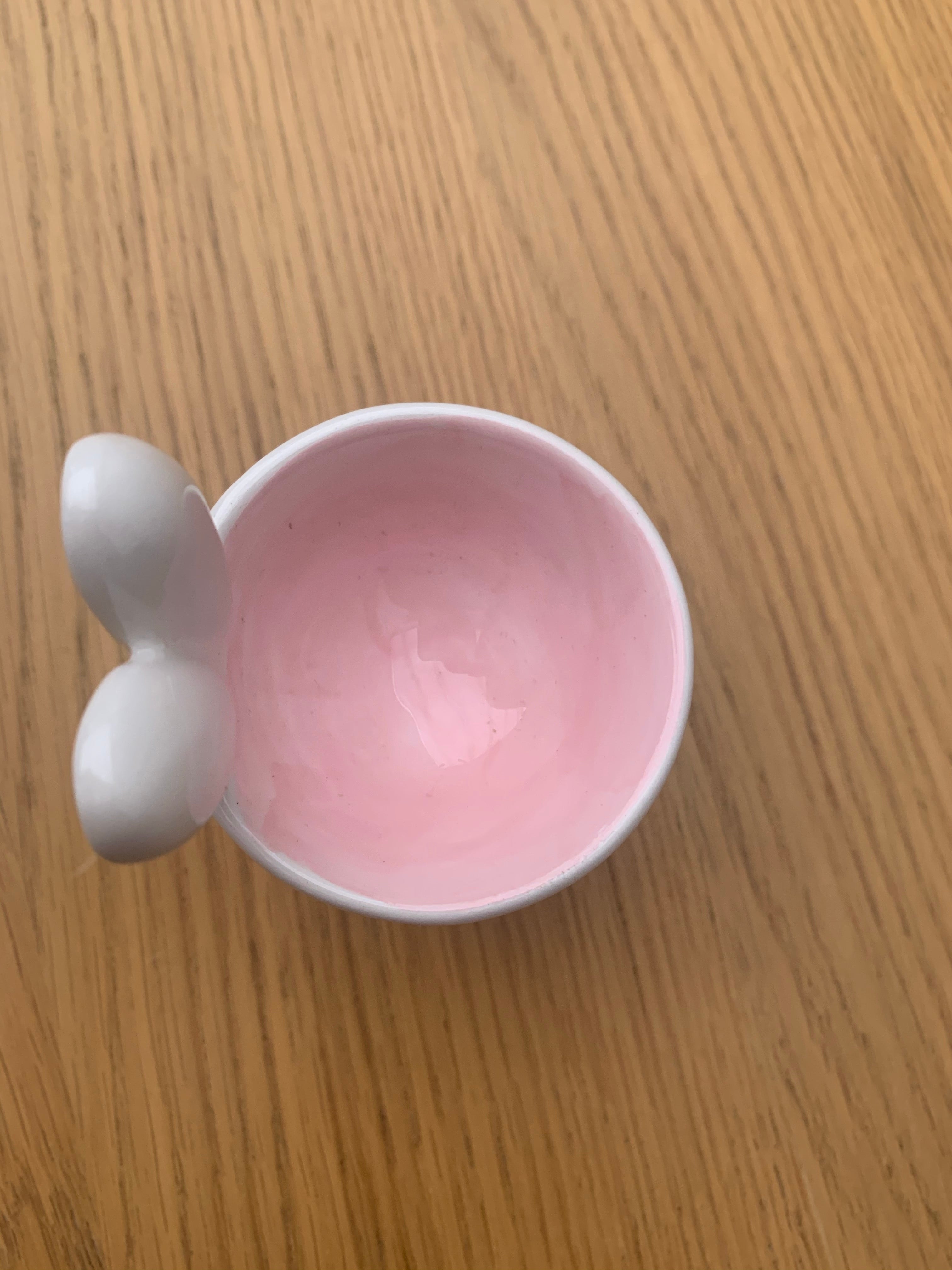 White Bunny ceramic egg cup from Sable Homeware, shaped like a bunny, with a smooth glossy finish and small handle for easy holding.