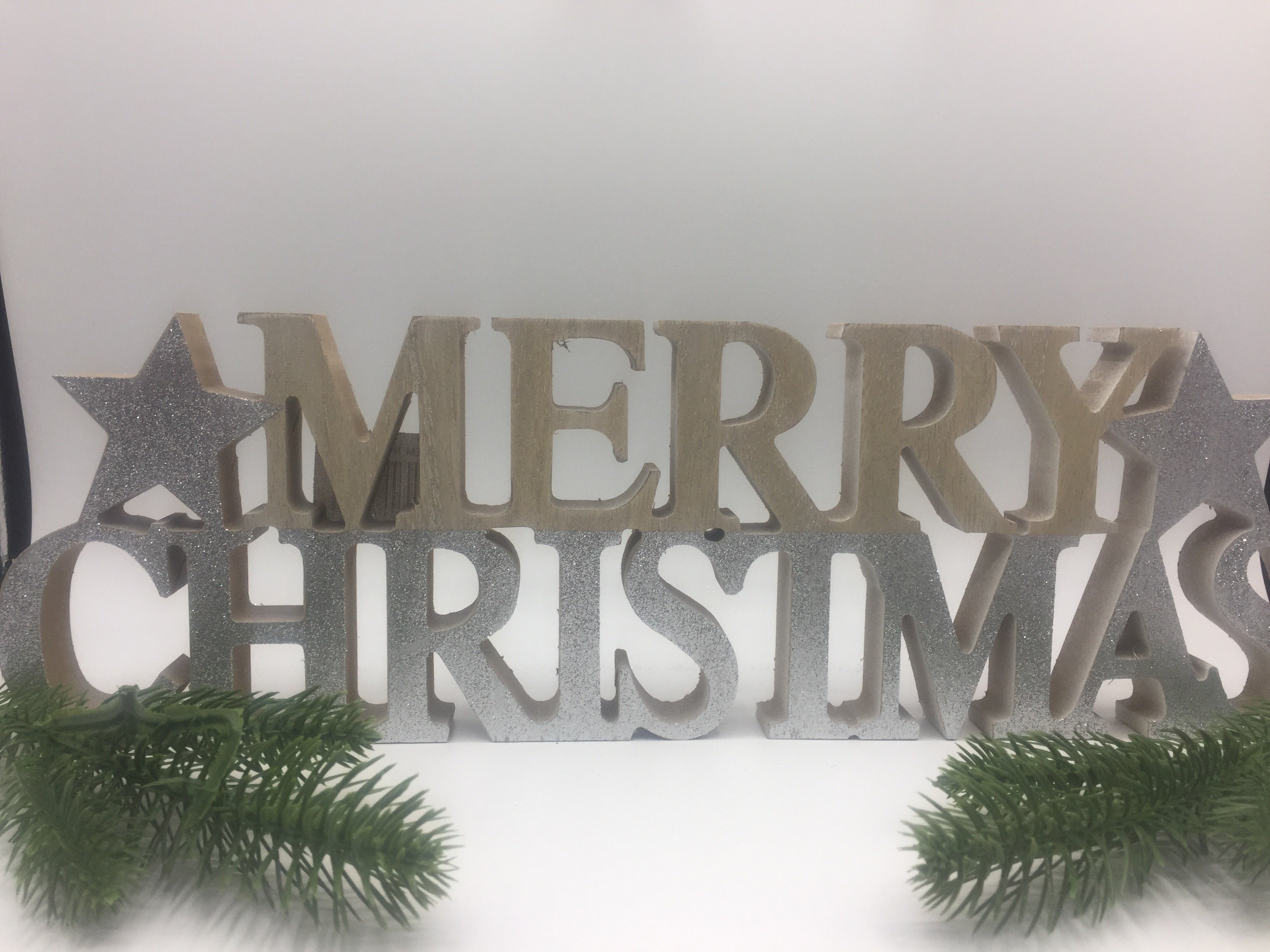 Wooden Merry Christmas standing words decoration by Sable Homeware, featuring two festive holiday design options.