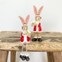 Sitting Santa rabbit decorative ornament with a star or present from Sable Homeware, perfect for holiday decor.