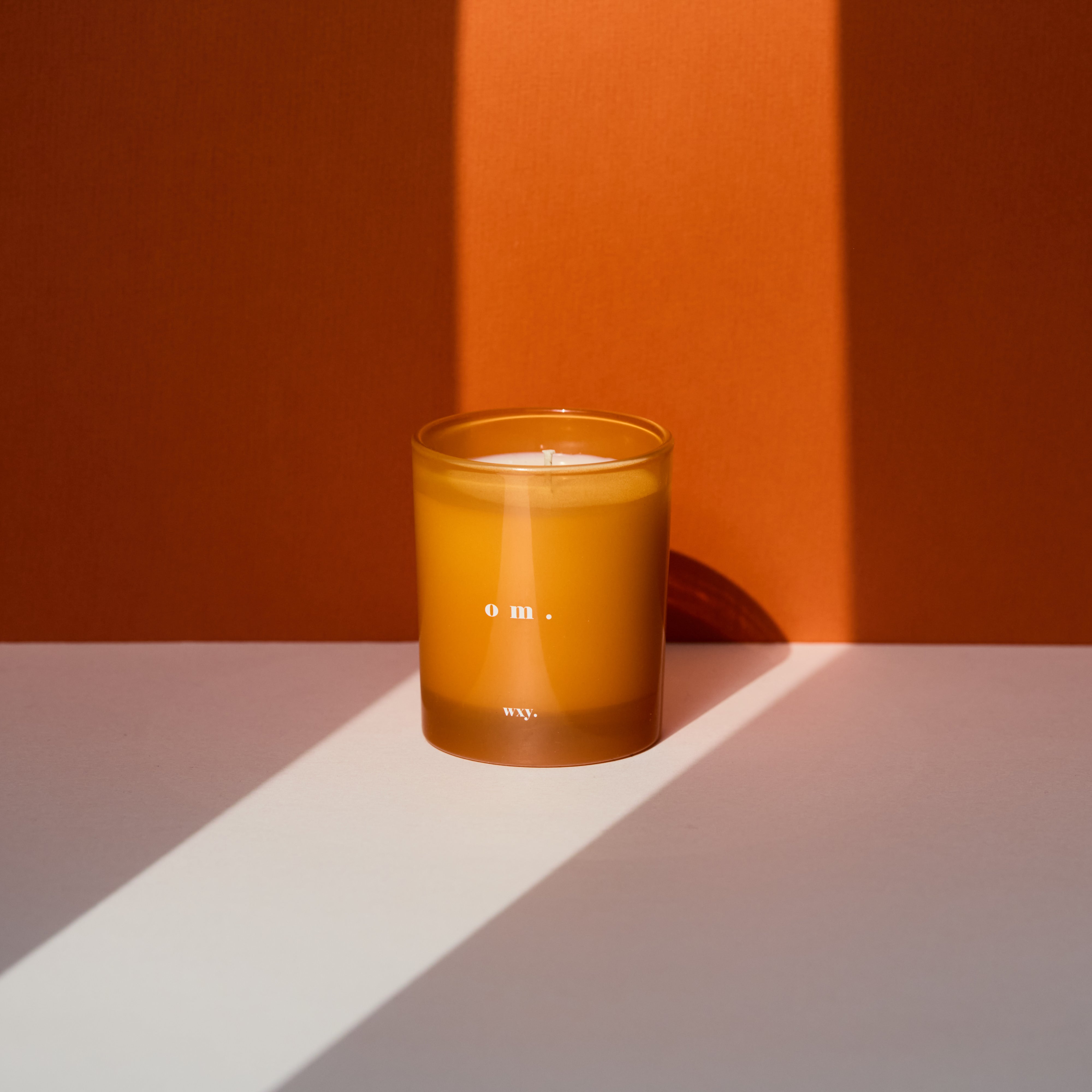 Sable Homeware Om Bamboo Leaf & Neroli Deluxe Candle in elegant candle holder, featuring bamboo leaf design and intricate detailing.