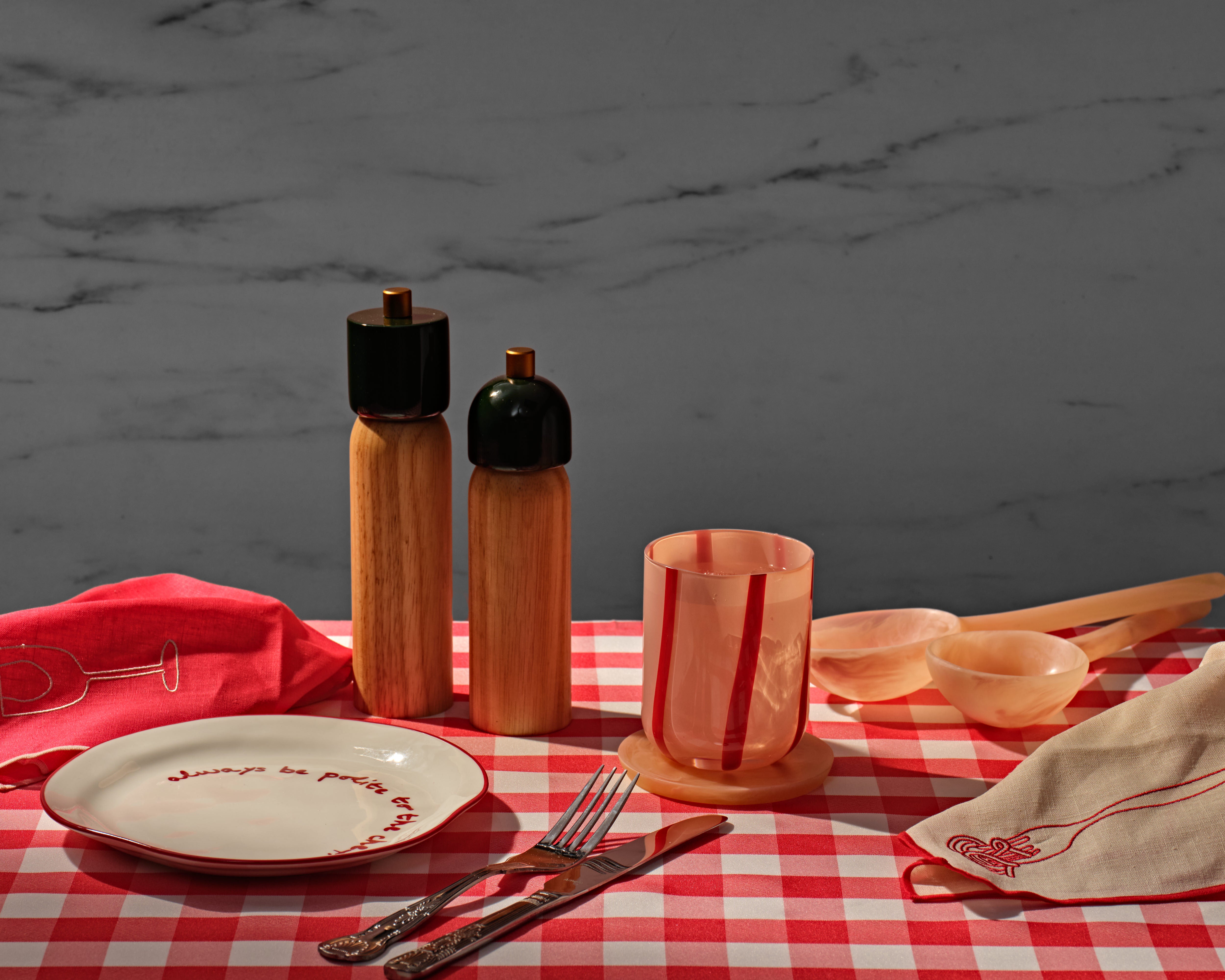 Sable Homeware Deluxe Salt and Pepper Grinder set on a table, showing the sleek design and adjustable grind settings.