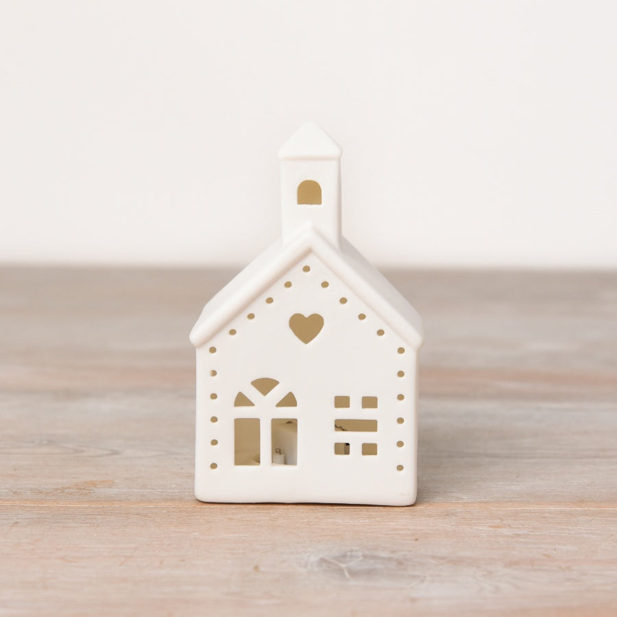 Shabbyquins LED Village with three charming china designs, featuring illuminated miniature buildings and scenic details.
