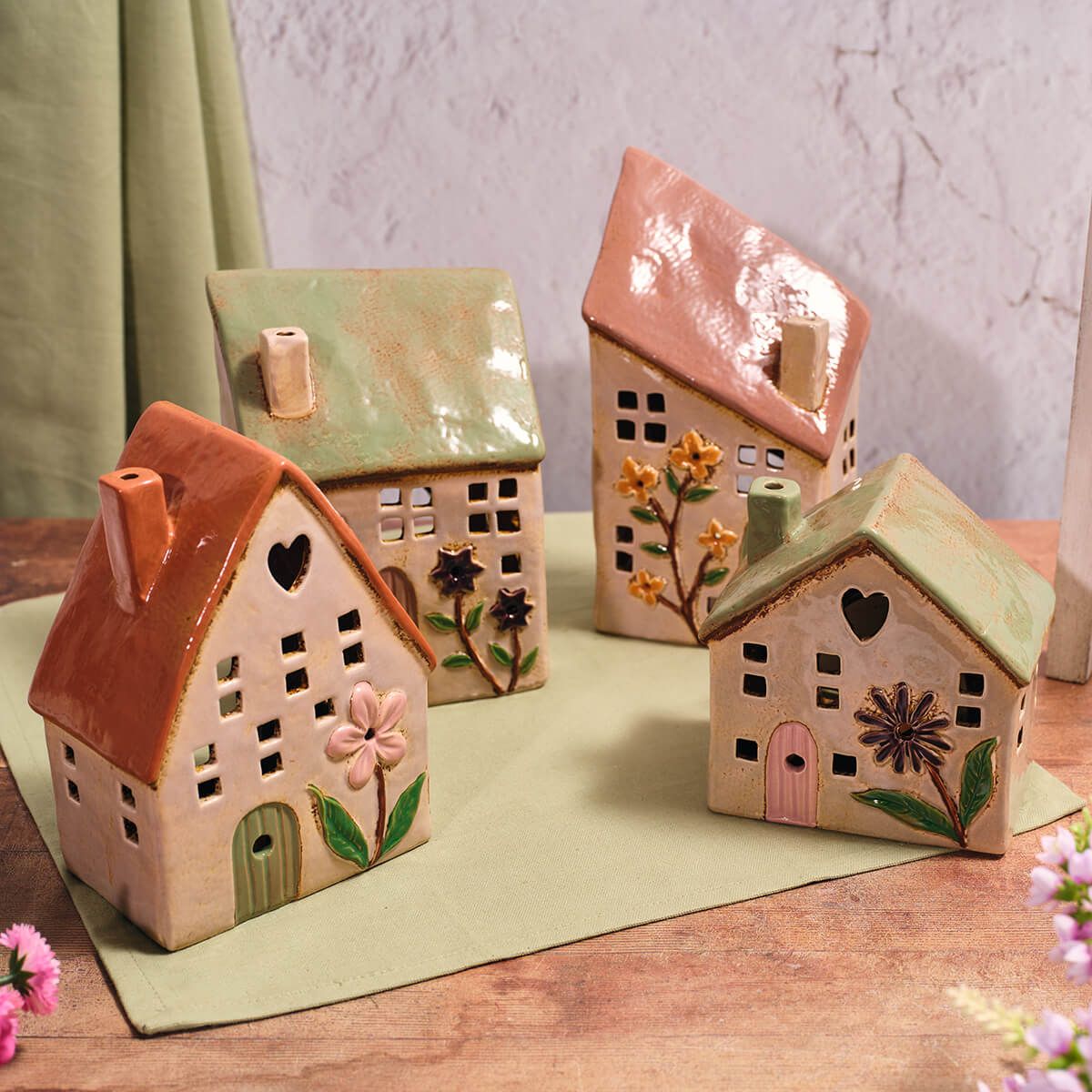 Stoneware house-shaped candle holders by Sable Homeware, featuring a rustic design and space for pillar or tea light candles.