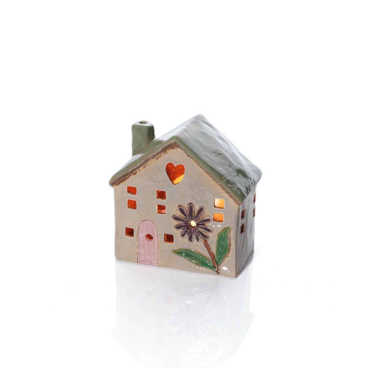 Stoneware house-shaped candle holder by Sable Homeware, featuring a rustic ceramic design with a hollow interior for candles.