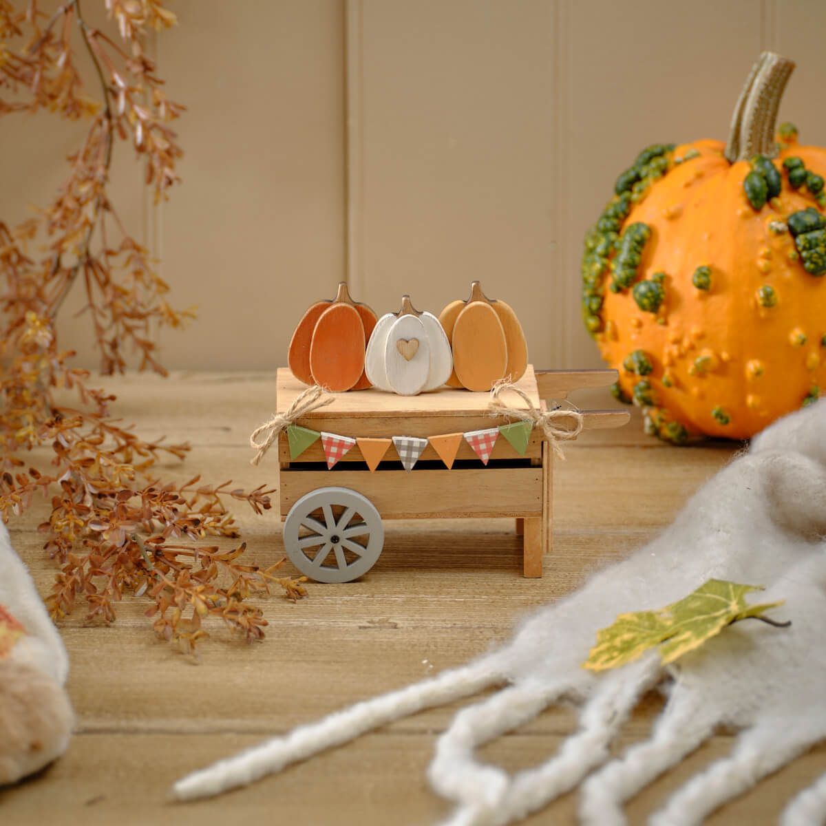 Shabbyquins Harvest Home wooden pumpkin cart ornament with rustic design, featuring orange pumpkins and autumn accents.